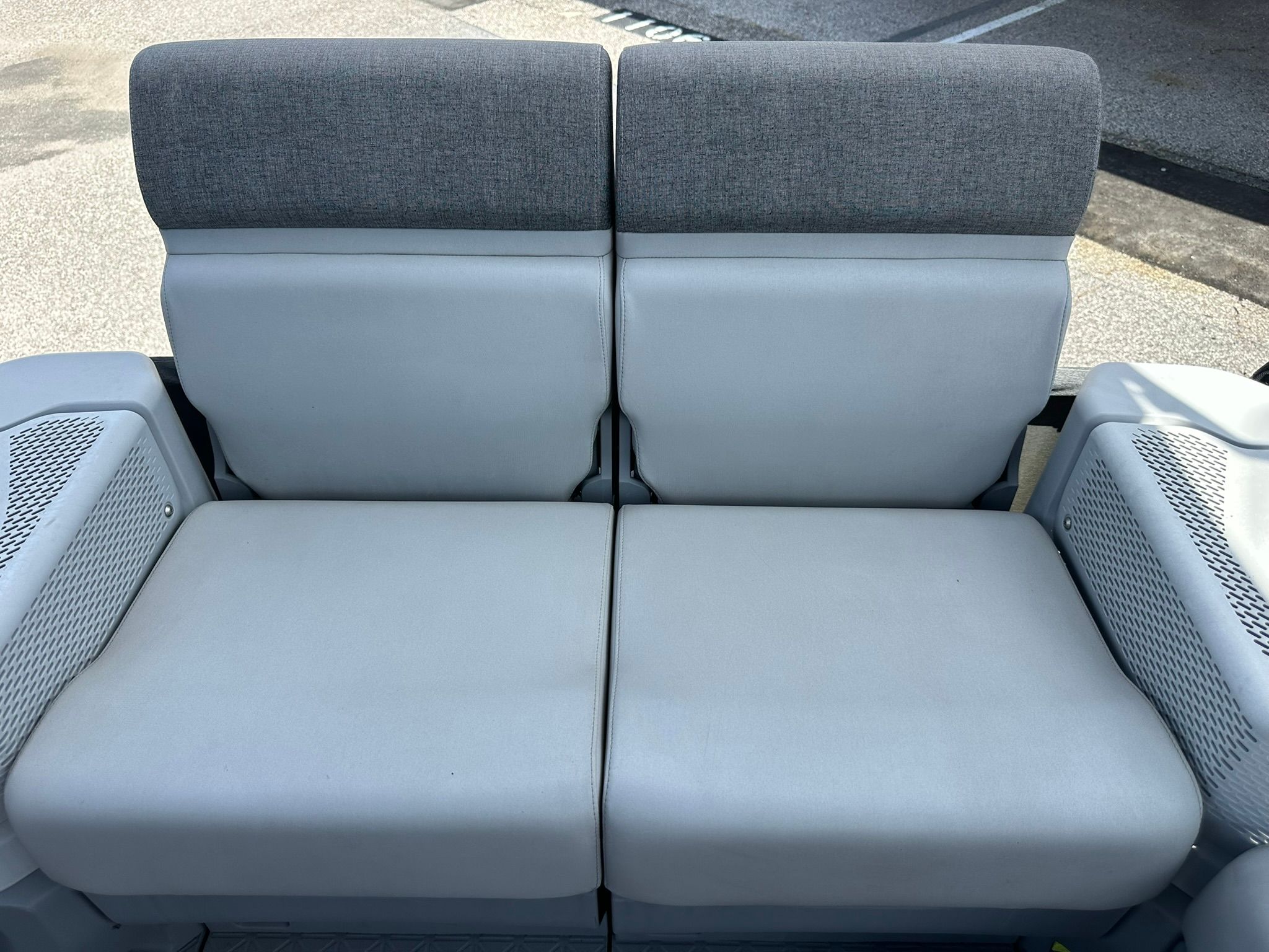 Rear seat of a Sea-Doo 21 SWITCH SPORT with gray upholstery.
