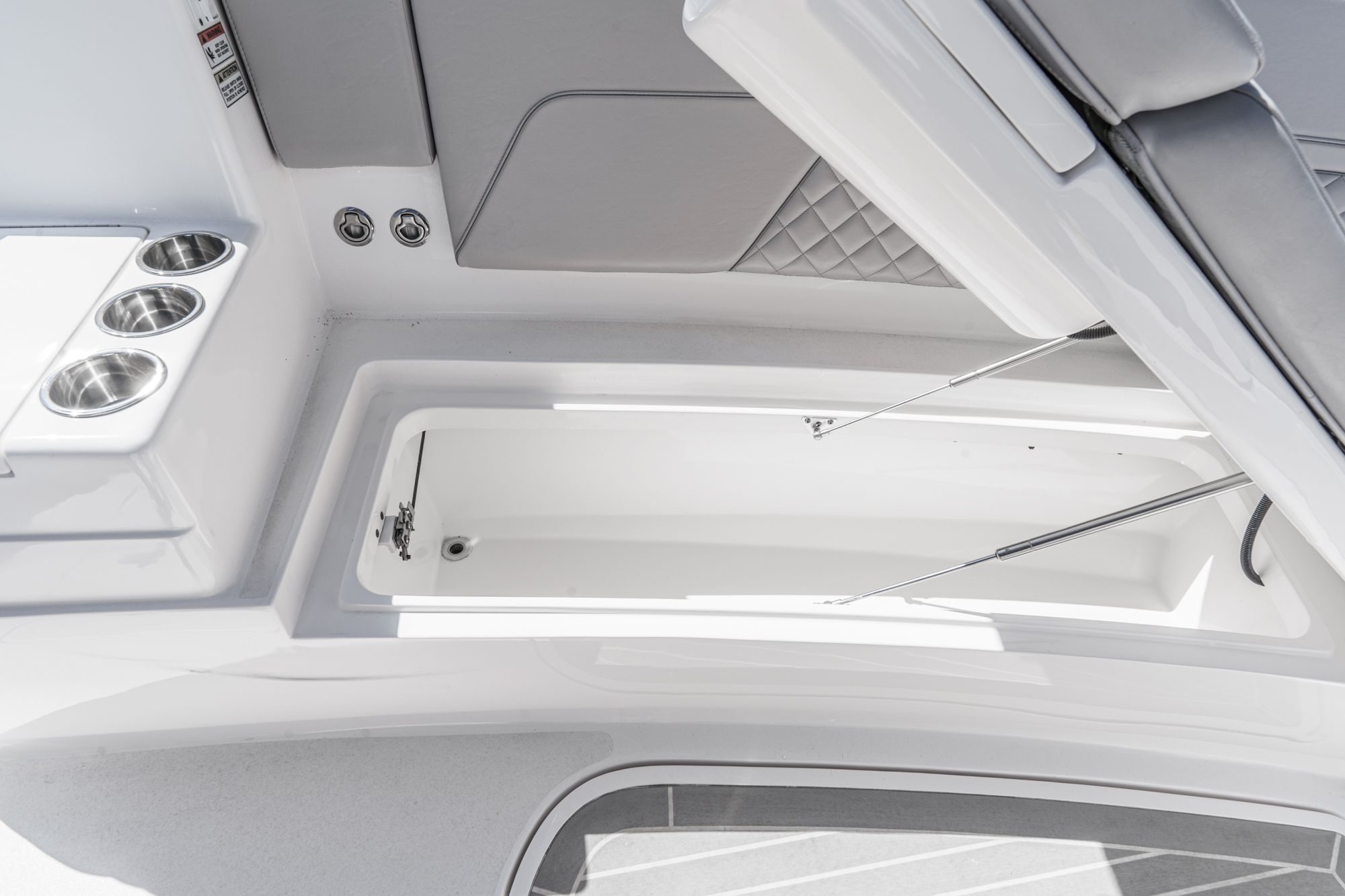 Intrepid 375 NOMAD 2021 boat interior with storage and cup holders.