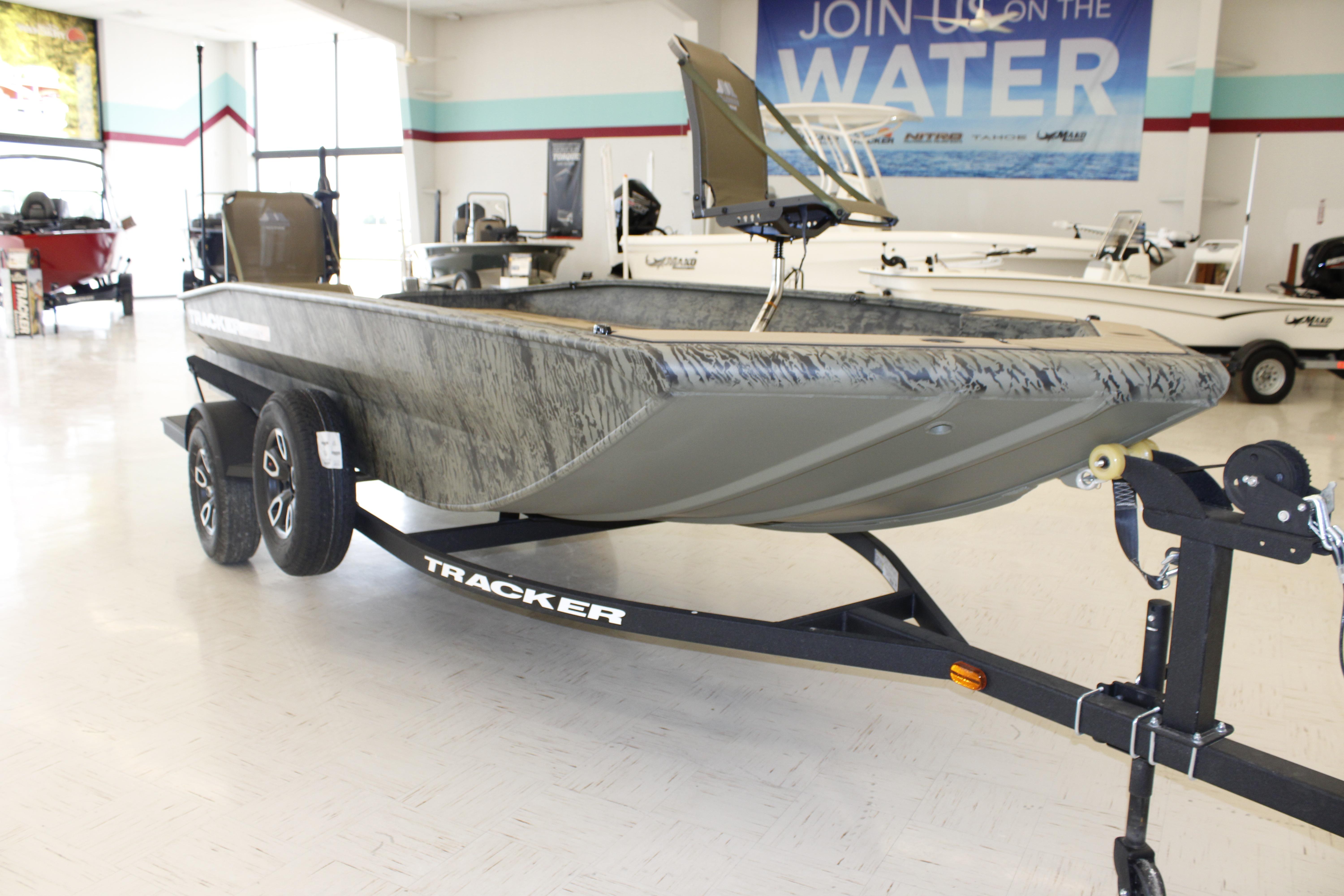 2026 Tracker Grizzly 1756 T Marsh boat on trailer in showroom.