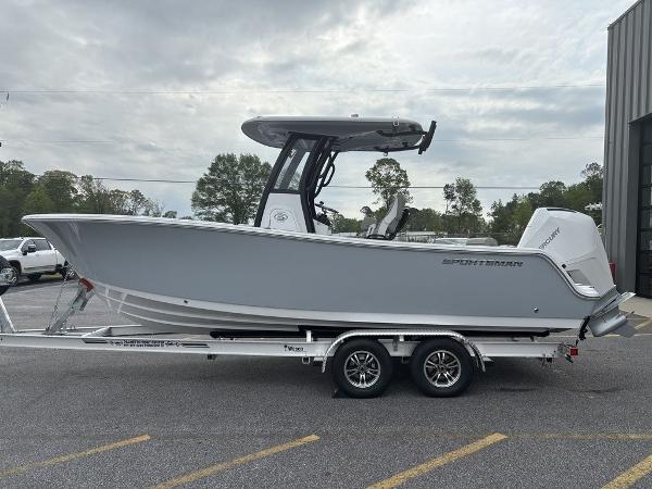 2025 Sportsman Open 232 boat on trailer, parked outdoors, side view.