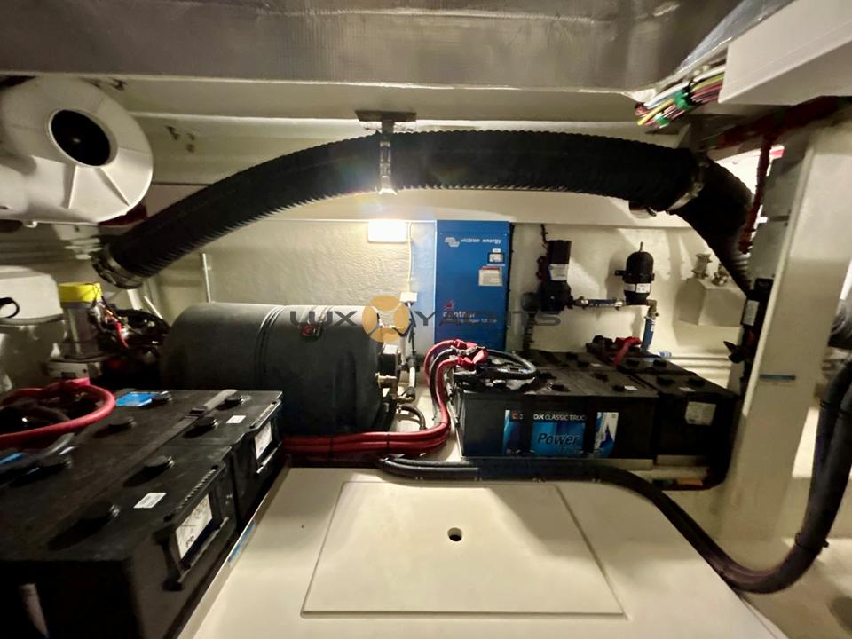 Engine room of 2021 Galeon 400 Fly yacht with visible batteries and equipment.