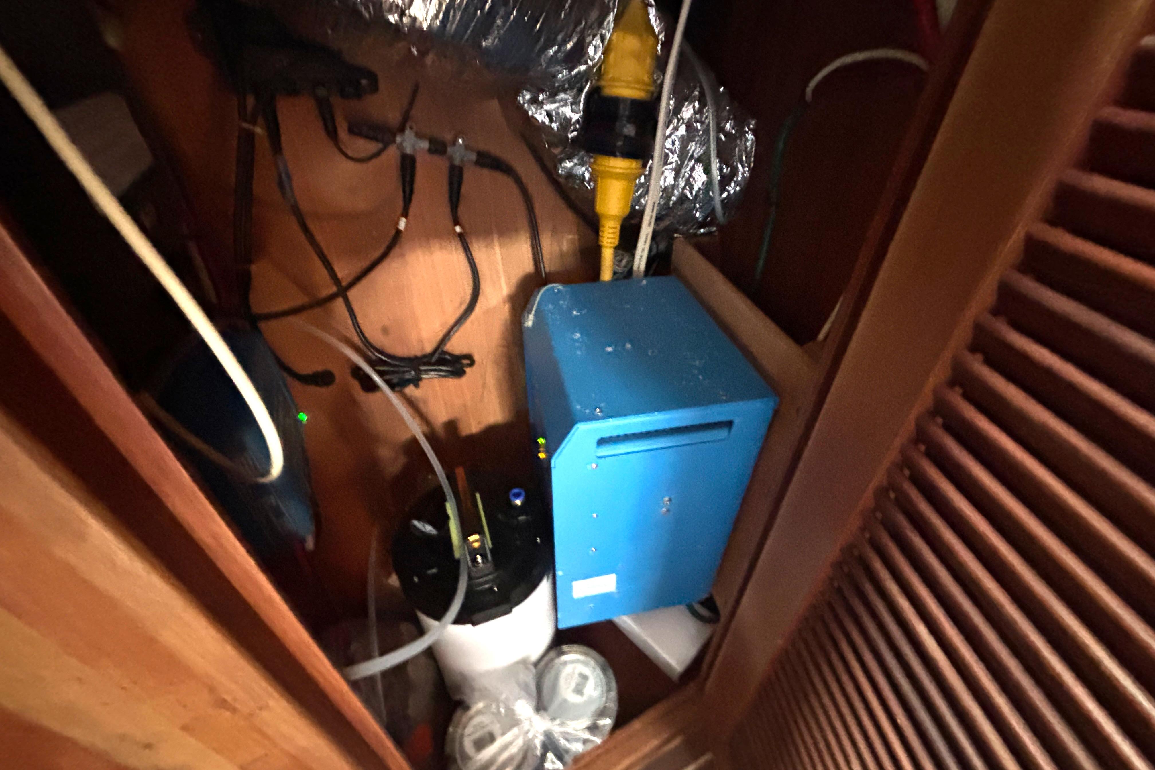 Electrical setup inside a 2002 Island Packet 380 sailboat, featuring wiring and equipment.