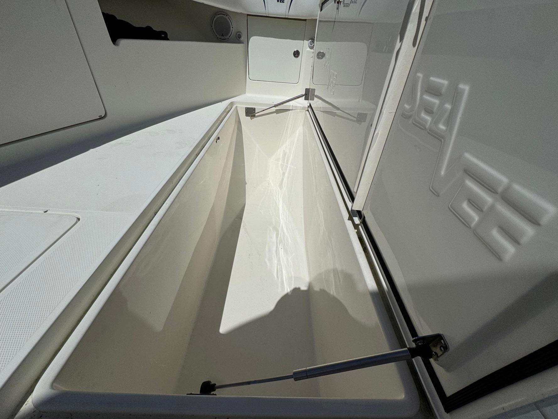 2014 SeaVee 390B Center Console storage compartment, open and spacious interior view.