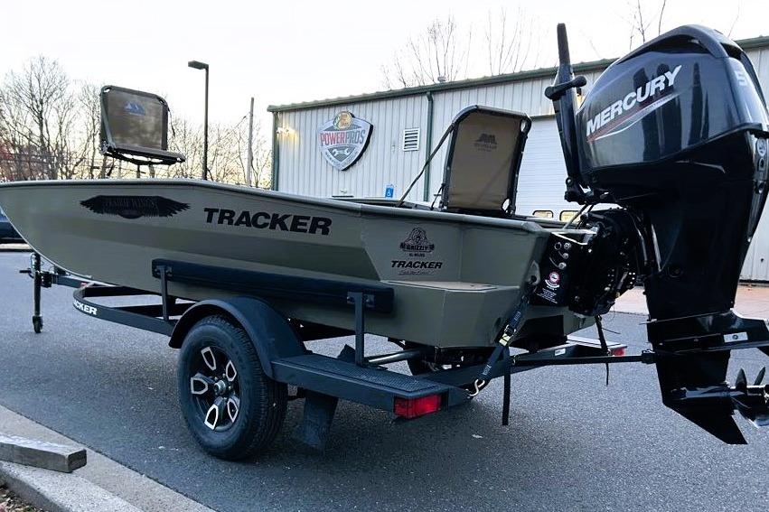 2026 Tracker Grizzly 1650 T Prairie Wings Edition boat with Mercury engine on trailer.