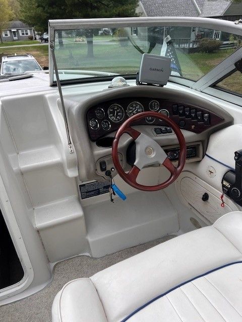 Interior view of a 1999 Crownline 266 CCR boat cockpit.