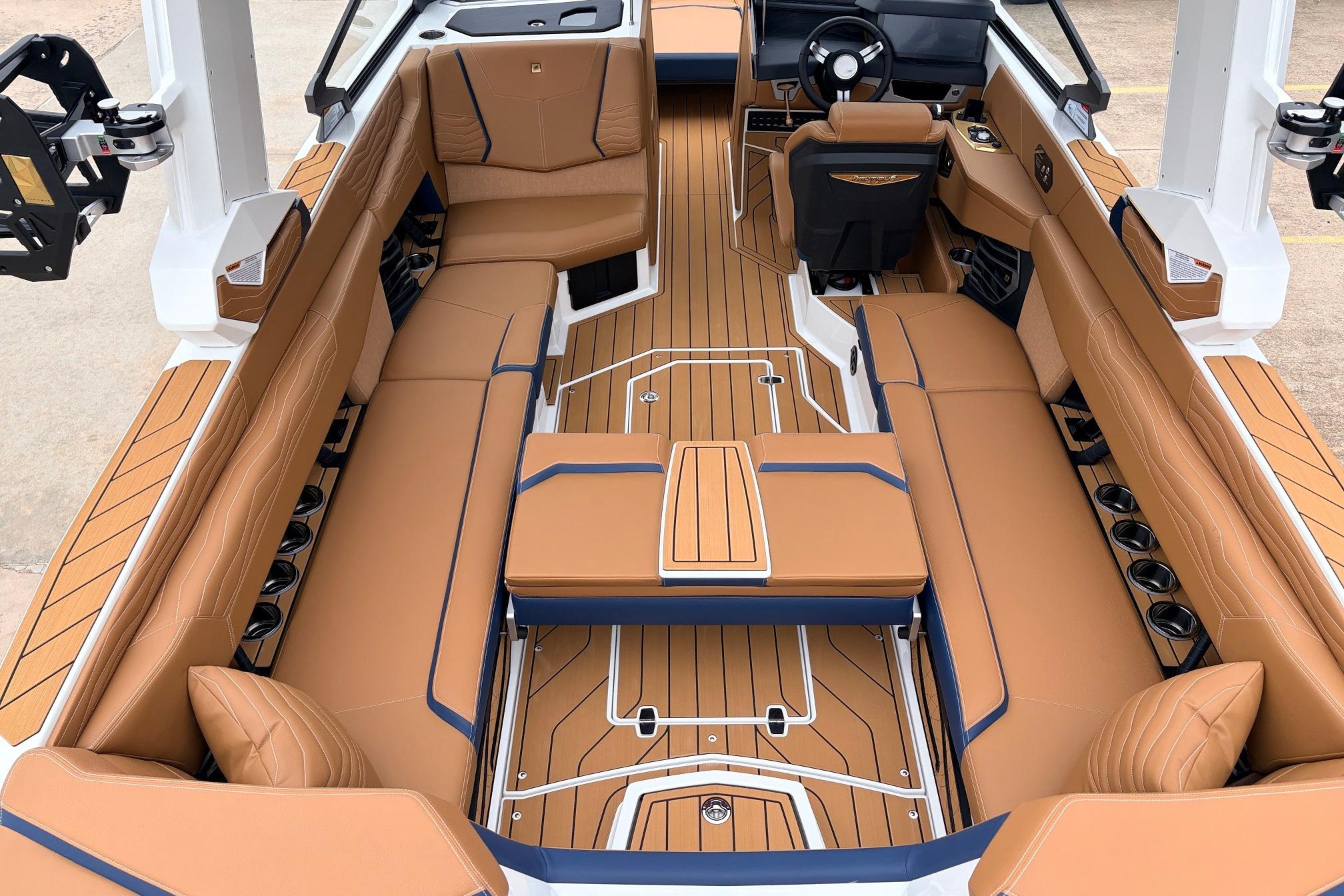 2026 Nautique Super Air Nautique G25 interior with luxurious tan seating and sleek design.
