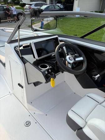 2021 Yamaha AR250 boat cockpit with steering wheel and controls.