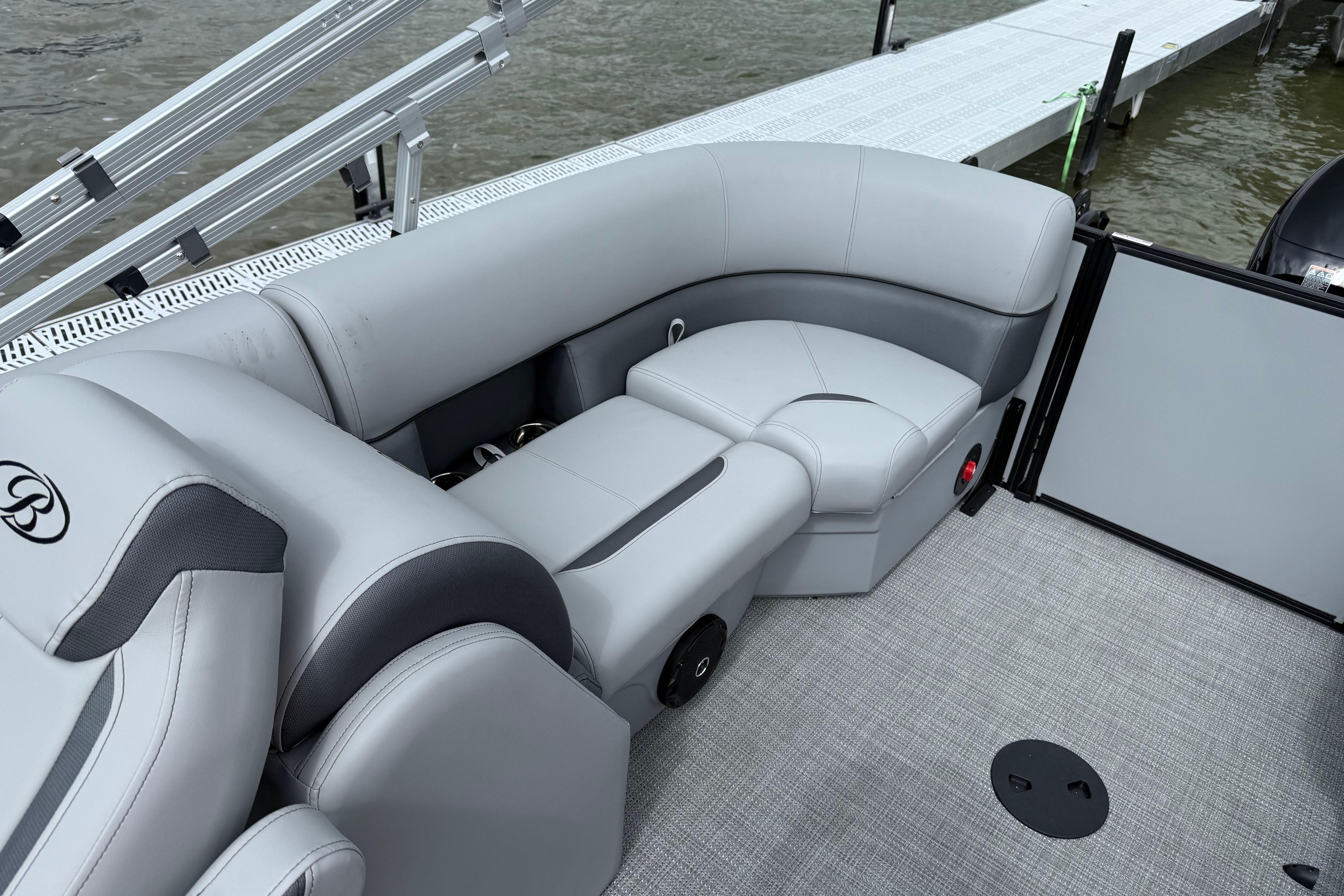 2026 Bentley Pontoons Legacy 220 Navigator interior with gray seating and modern design.