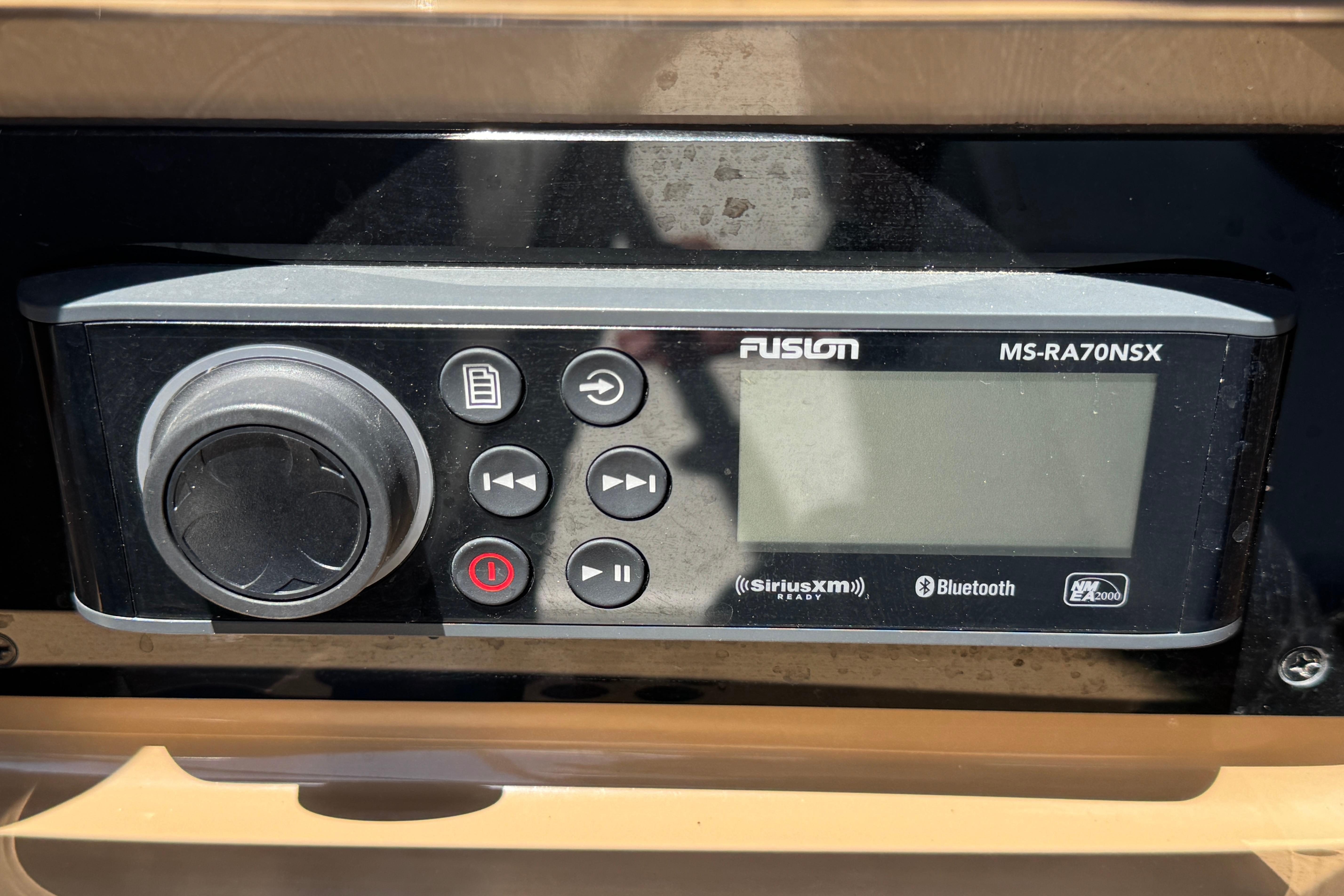 Fusion MS-RA70NSX stereo system on 2002 Carver 396 Motor Yacht dashboard.
