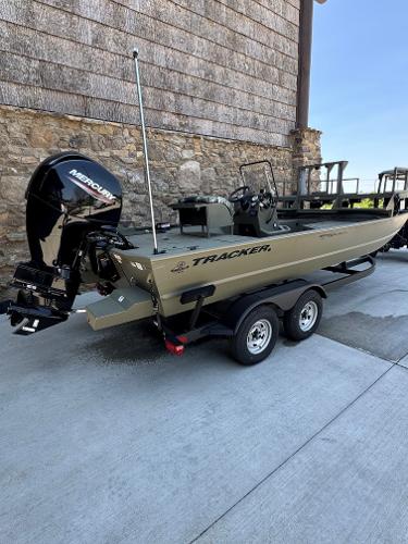 2025 Tracker Grizzly 2072 CC Sportsman boat with Mercury engine on trailer.