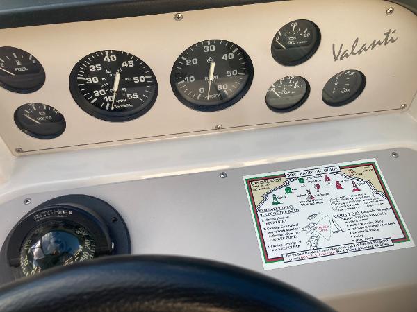 Dashboard of a 1992 Regal Valanti 200 boat with compass and gauges.