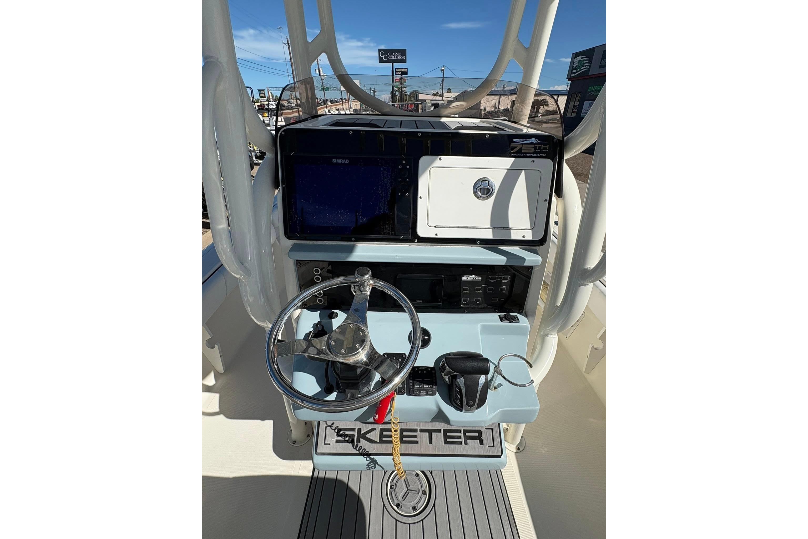 2023 Skeeter SX2550 Family boat dashboard with steering wheel and controls.