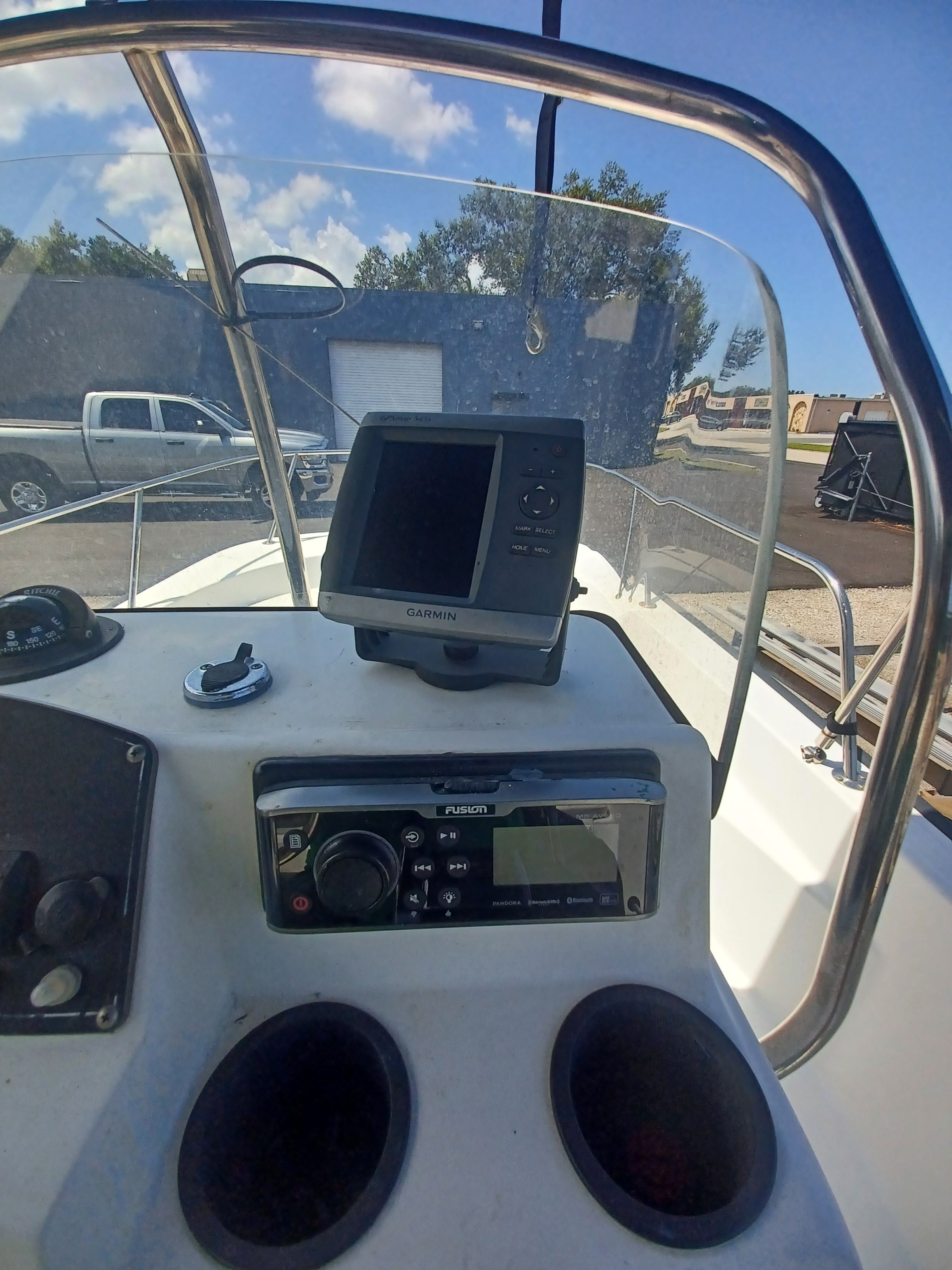 The image shows the cockpit of a 2008 Boston Whaler 170 Montauk with electronics.