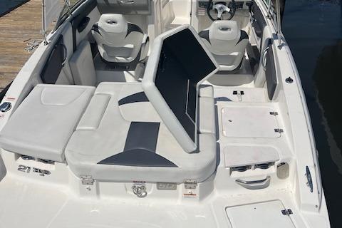 2015 Chaparral 21 H2O Sport boat interior with seating and steering wheel.