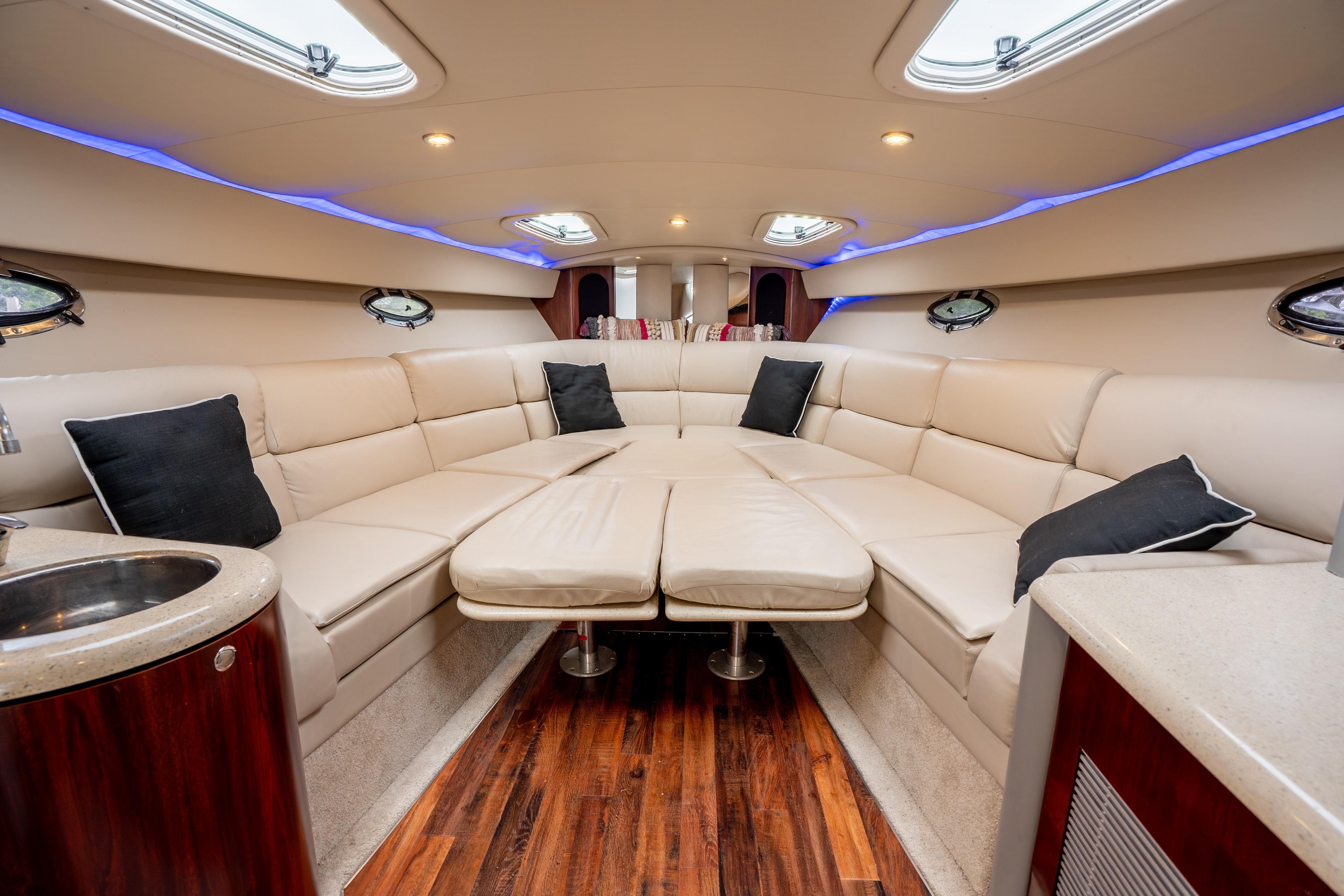 Luxurious interior of a 2006 Formula 400 Super Sport yacht with plush seating and modern design.