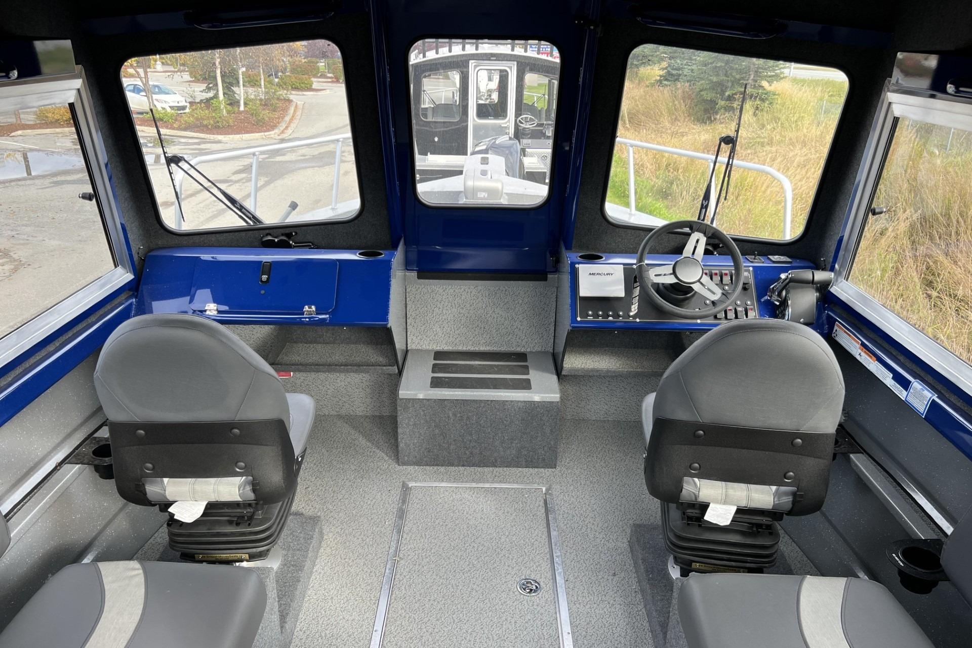 2024 Spartan 26 Maximus Pro XL boat interior with steering console and seating.