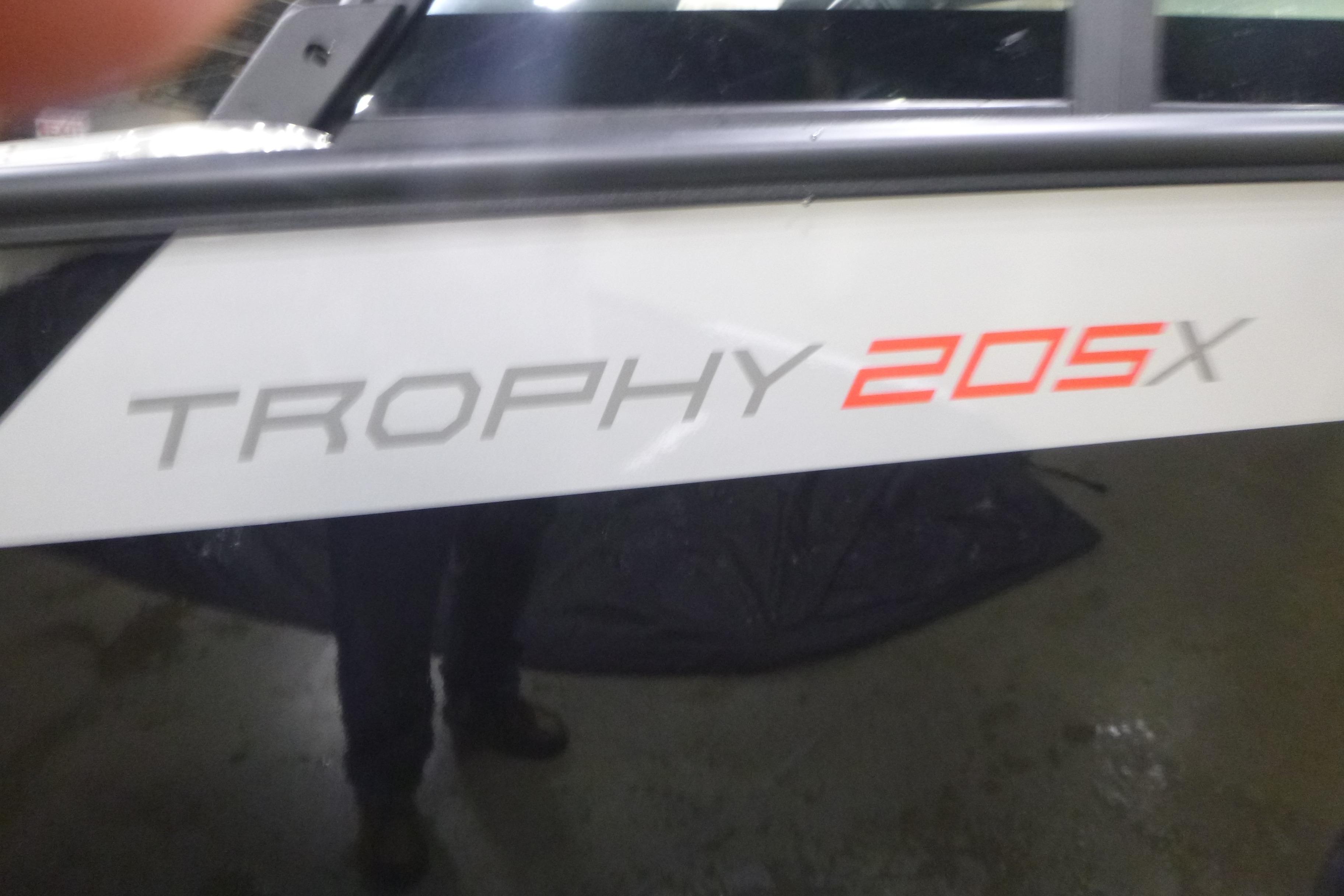 2026 Alumacraft Trophy 205X Sport boat logo on side panel.