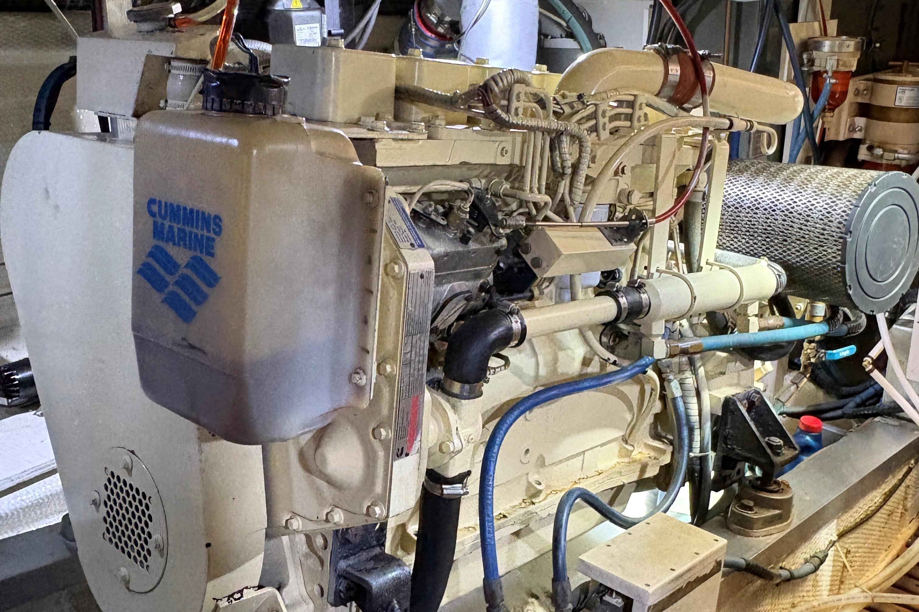 Engine room of a 1990 Grand Banks Classic boat with Cummins Marine engine.