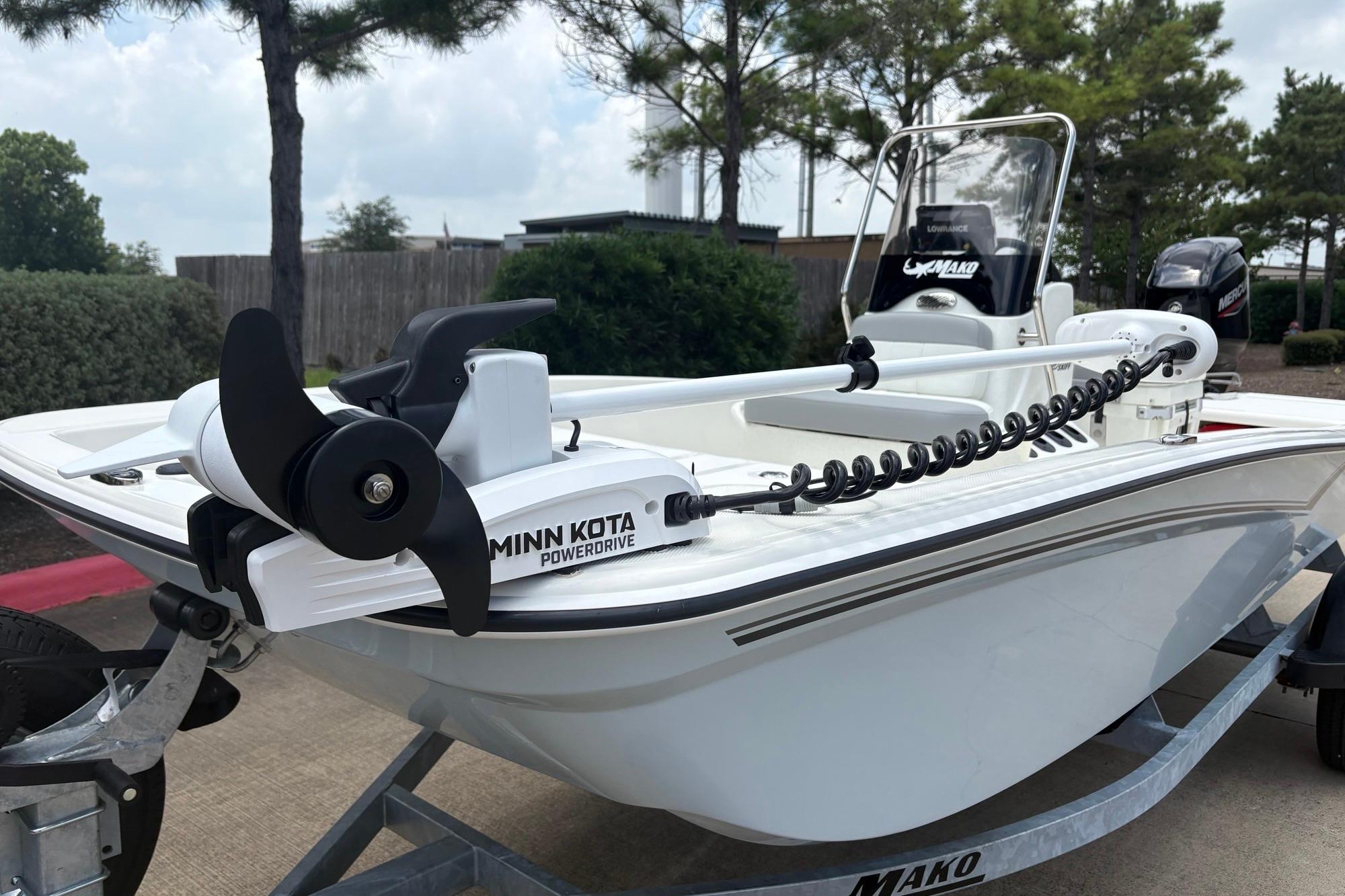 2026 Mako Pro Skiff 15 CC with Minn Kota PowerDrive trolling motor on trailer.