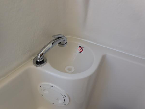 2024 Sailfish 242 CC boat sink with chrome faucet.