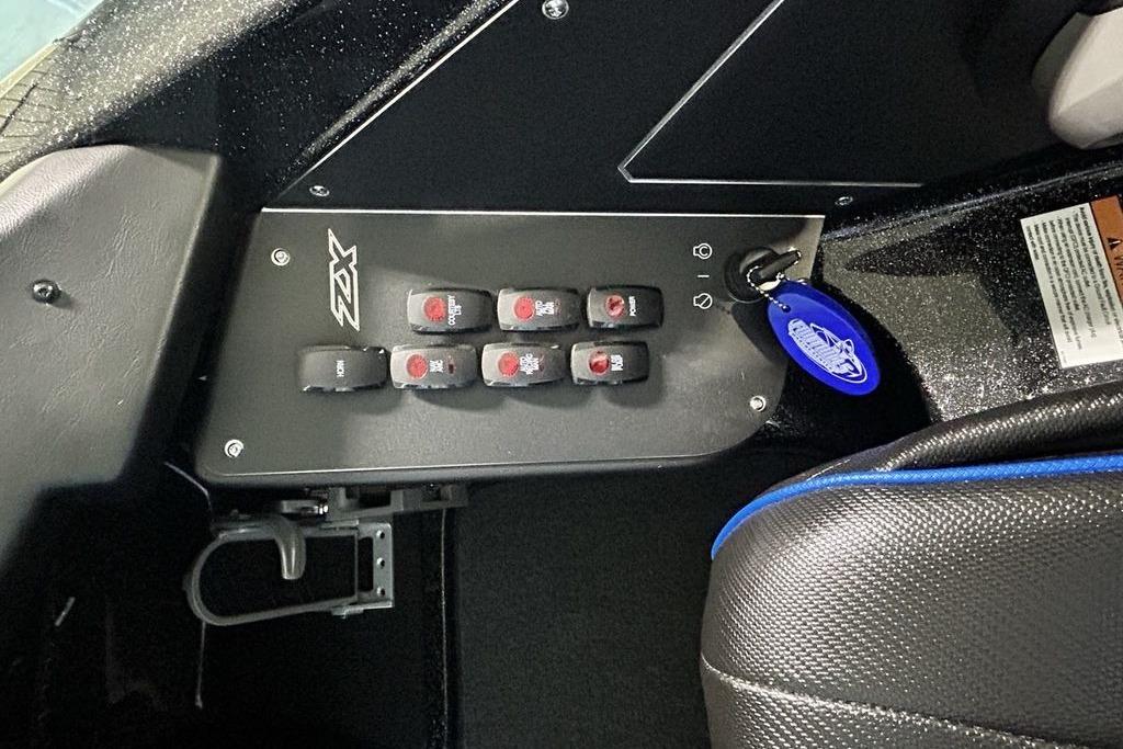 Control panel of 2026 Skeeter ZX200 boat with switches and key fob.