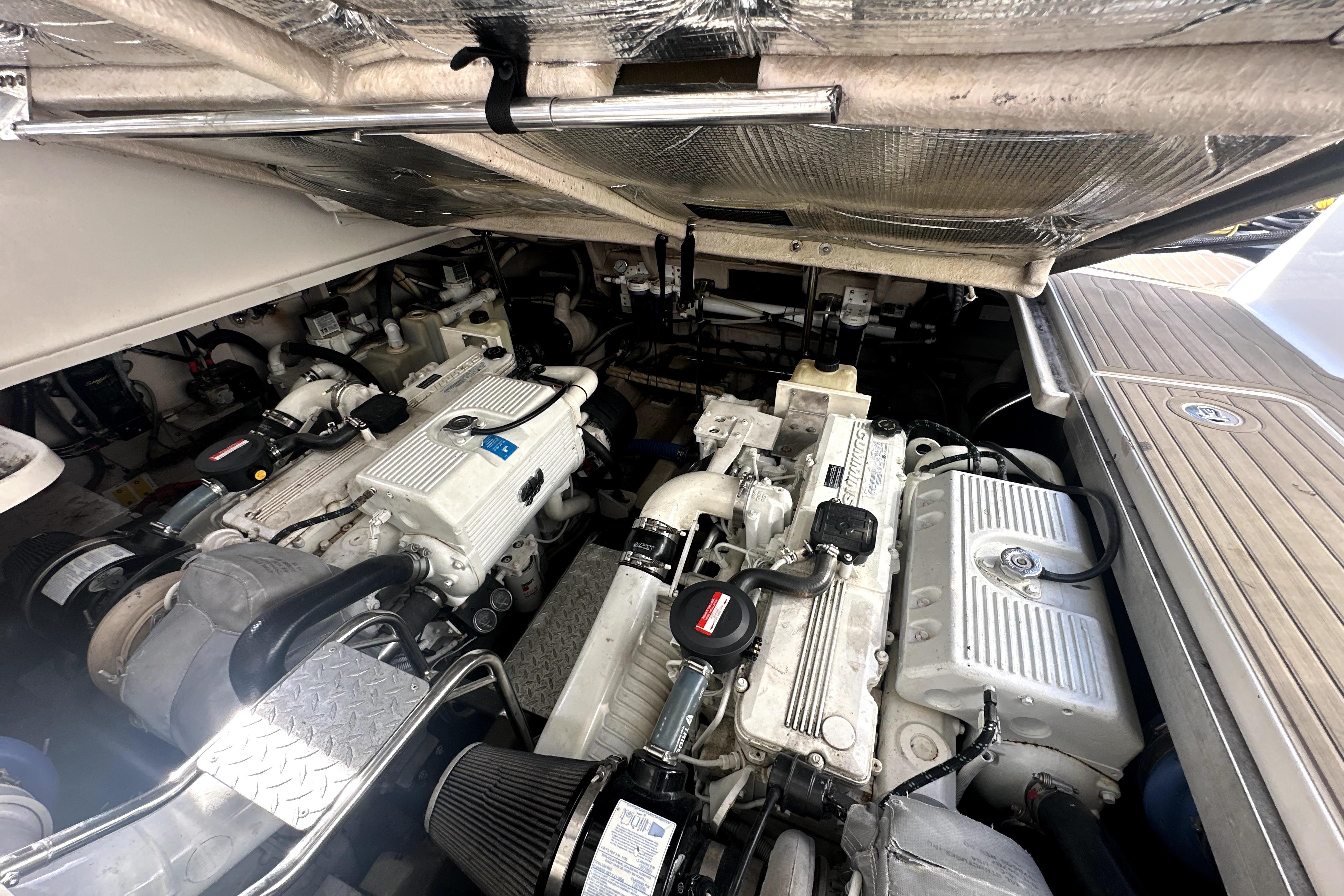 Engine room of a 2007 Sea Ray 44 Sundancer, showcasing dual engines and mechanical components.