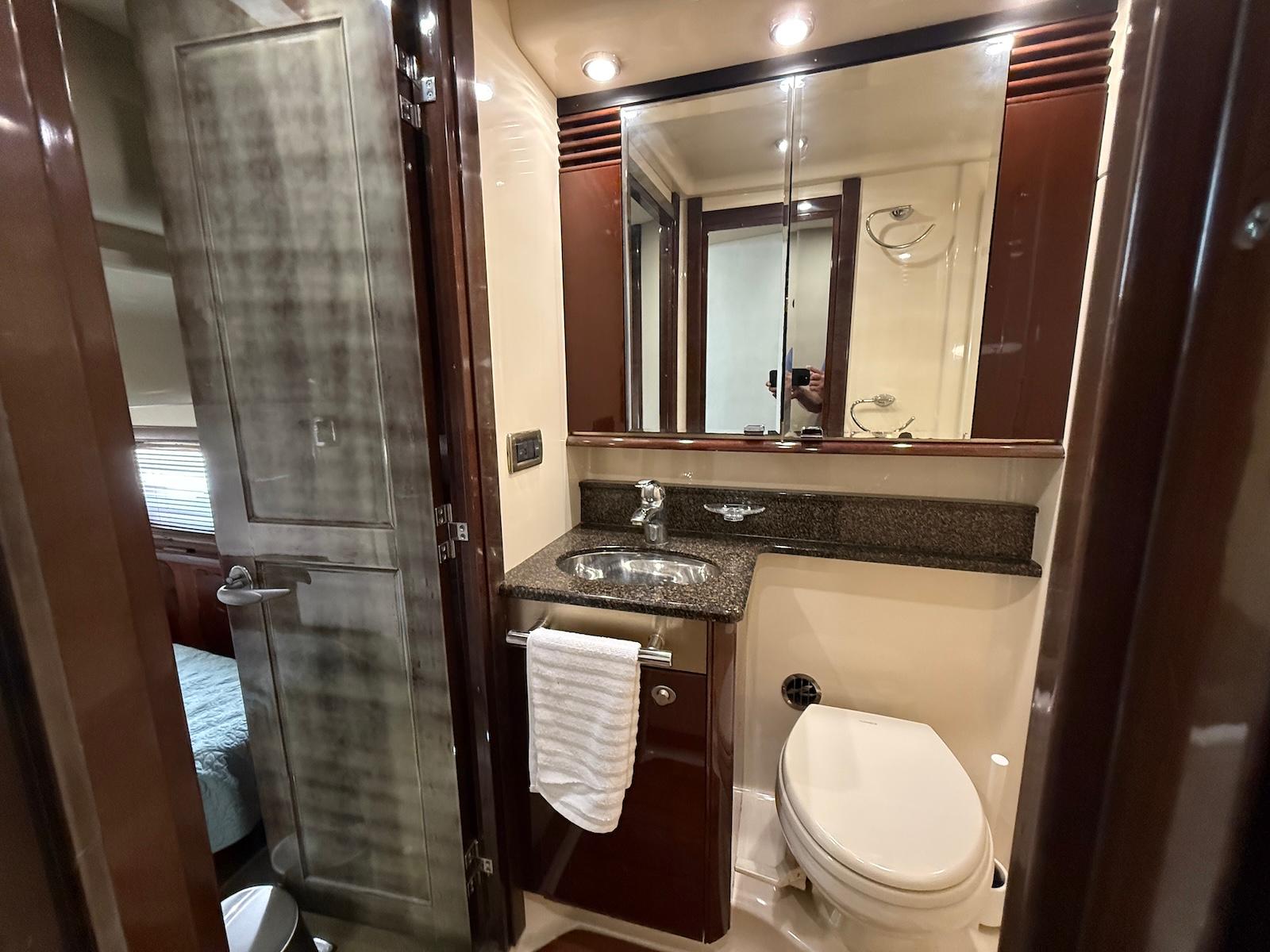 Luxurious bathroom in 2007 Sea Ray 52 Sedan Bridge yacht with modern fixtures.