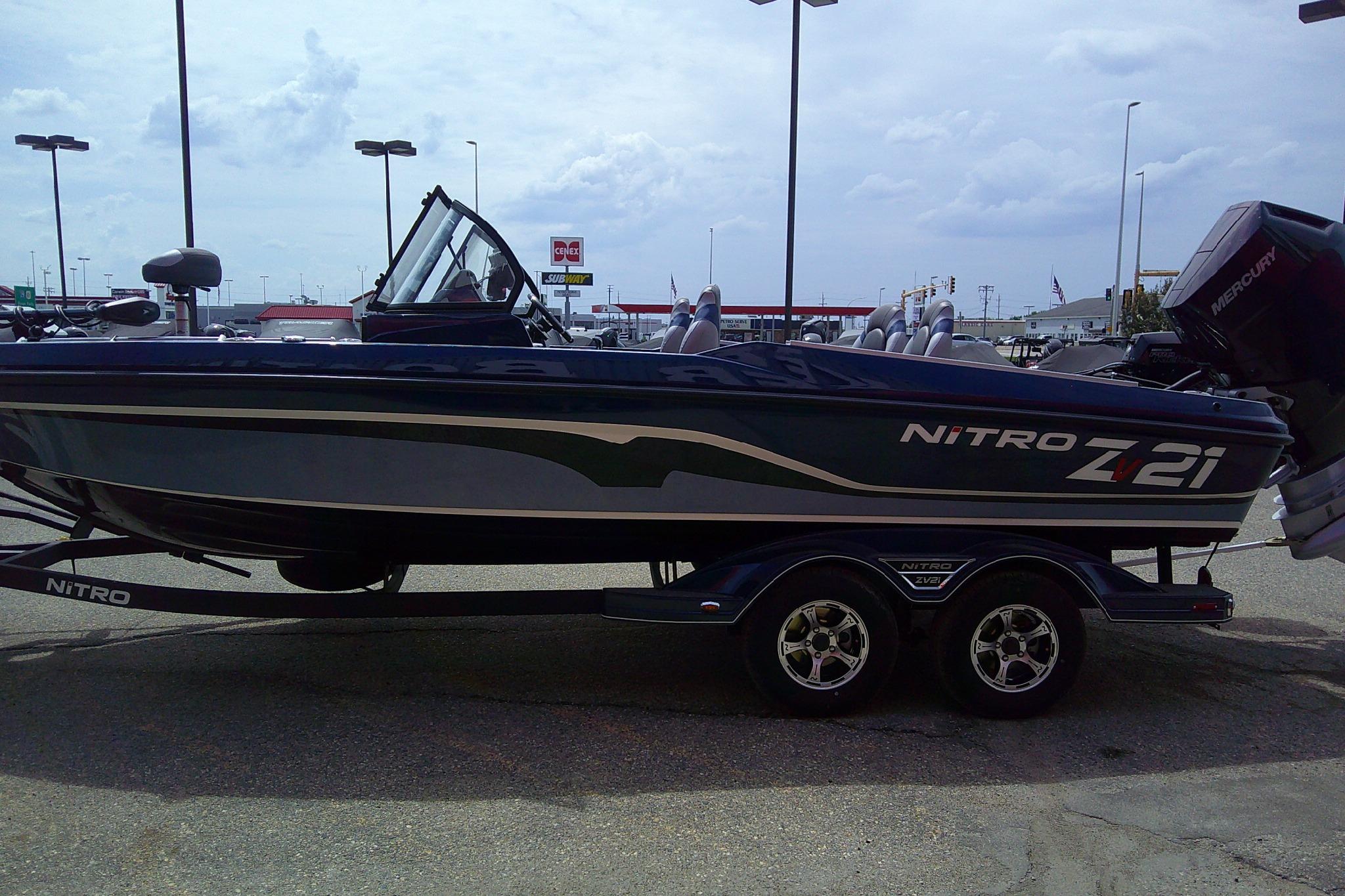 2026 Nitro ZV21 Pro boat on trailer in parking lot.