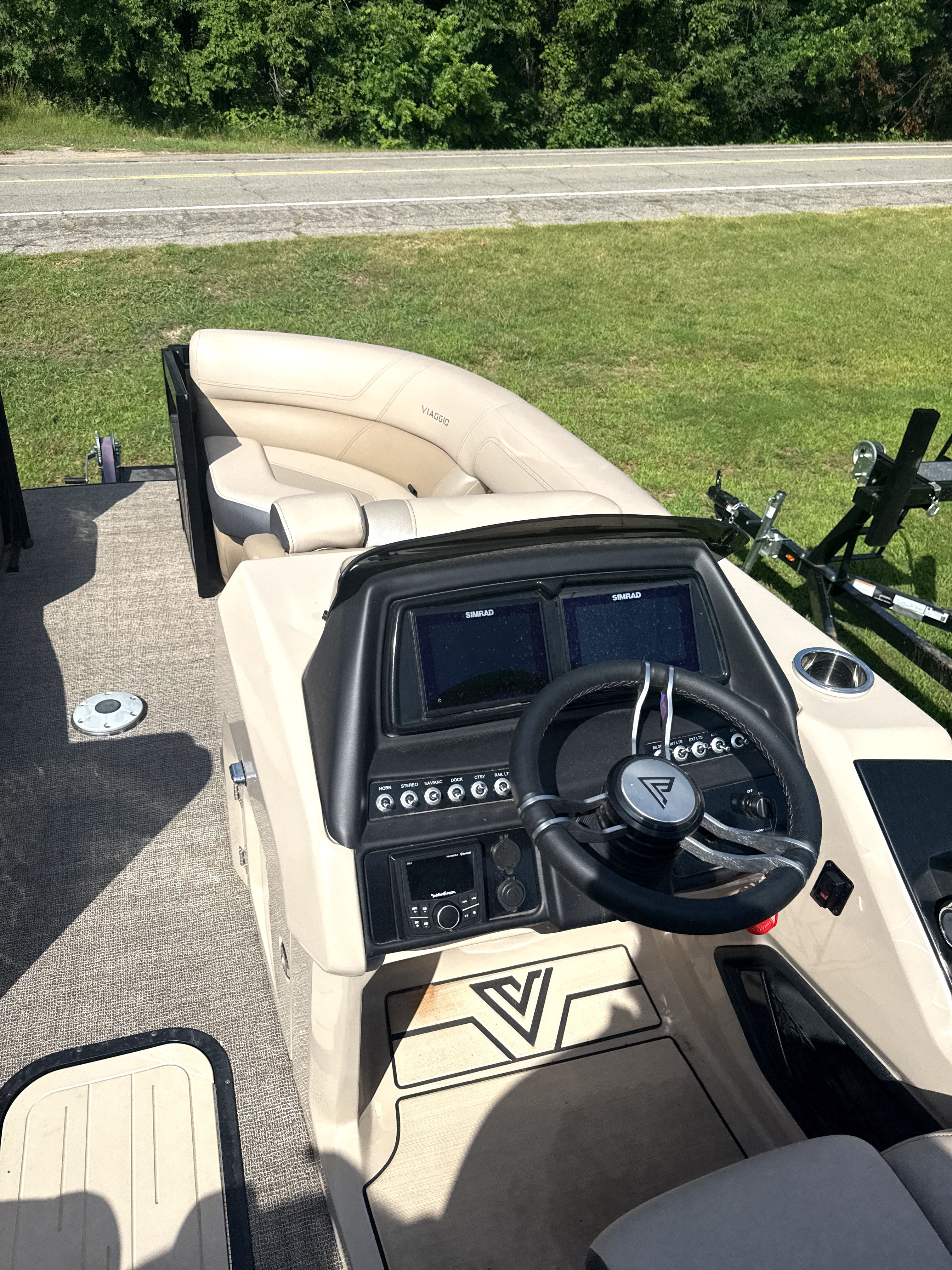 Interior view of 2023 Viaggio Diamante D23S boat with helm console.