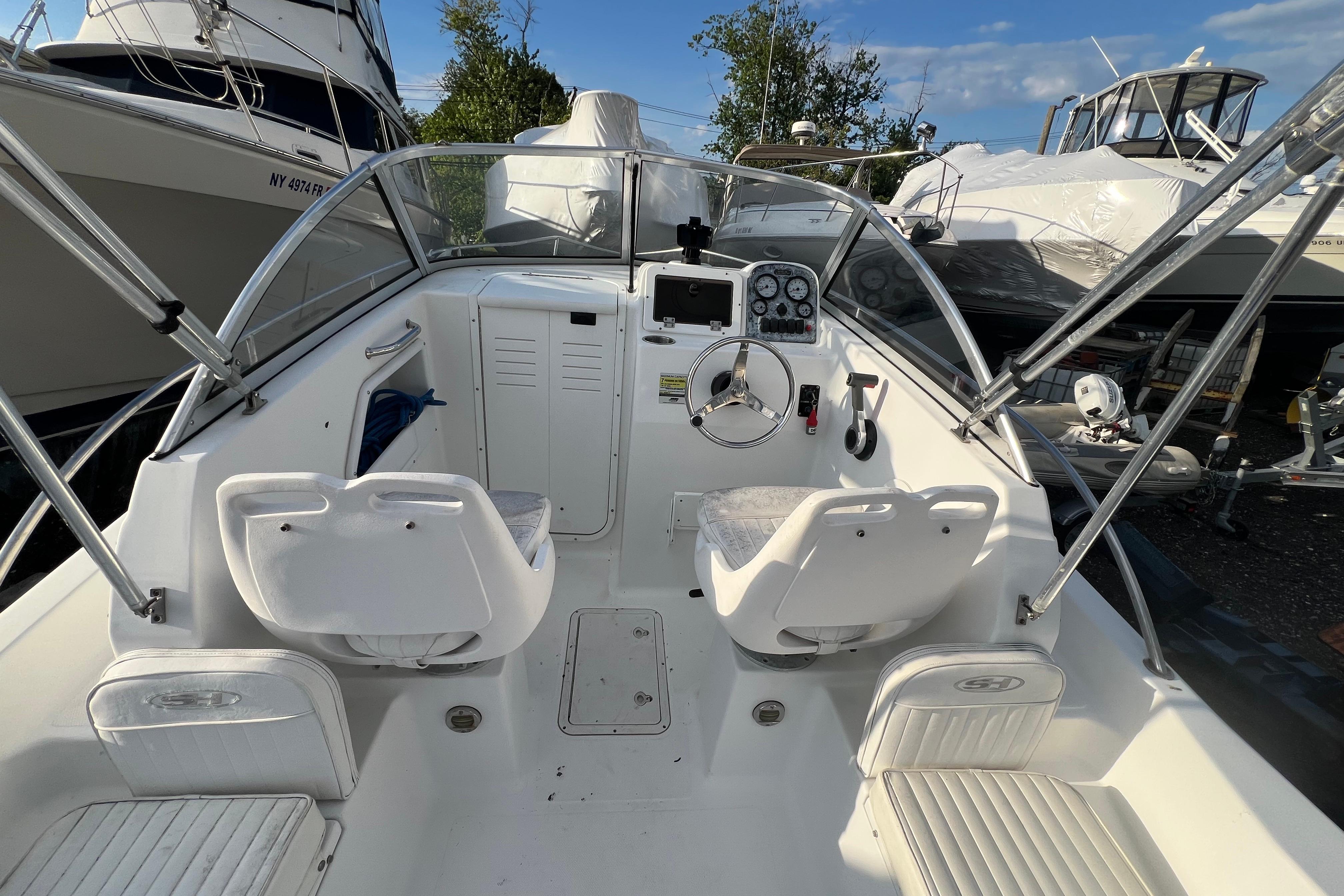 2008 Sea Hunt Victory 207 boat interior with steering wheel and seating.