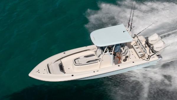 2024 ShearWater 270 SS Open Carolina boat cruising on clear blue water.
