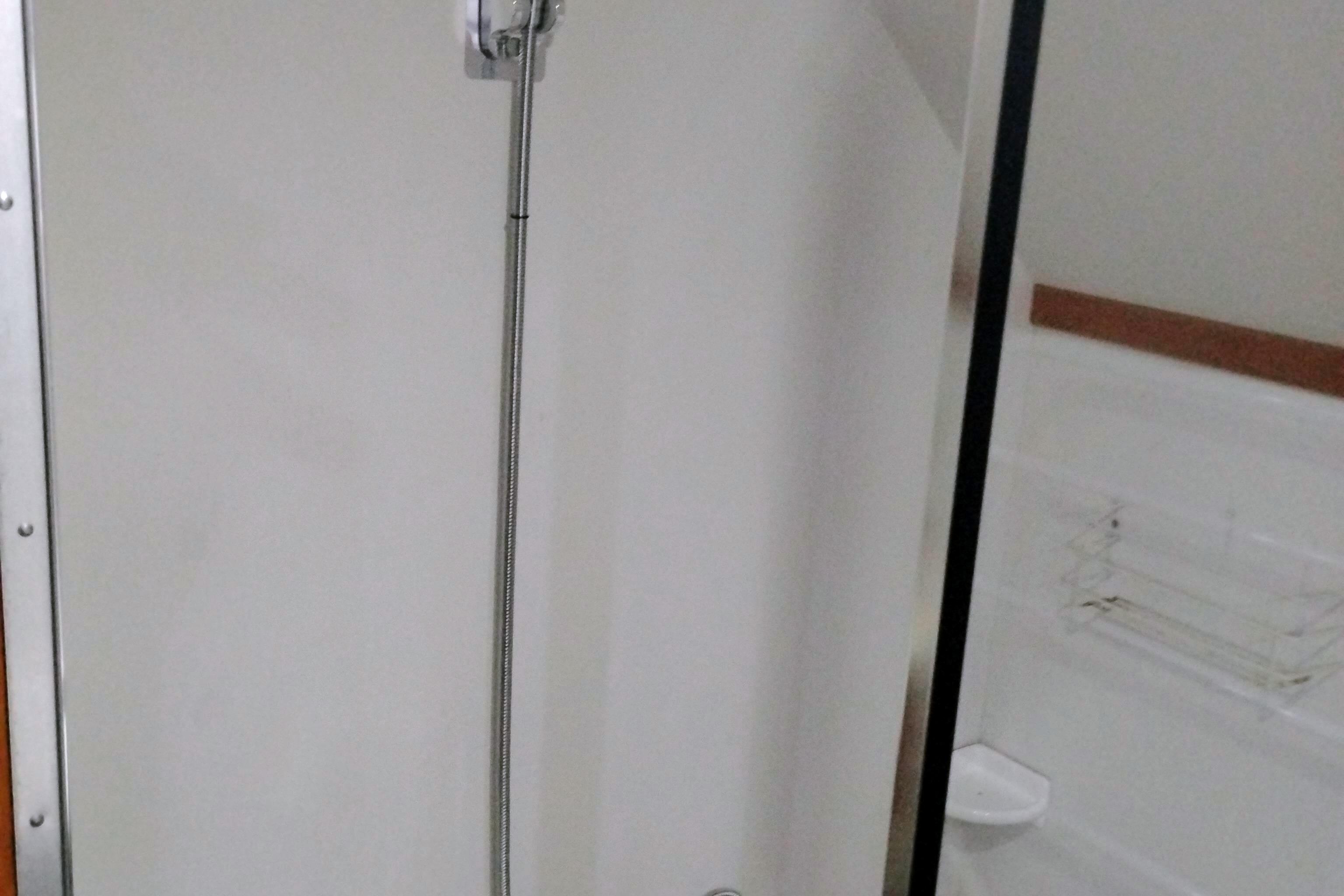 Shower area in 1991 Californian 52 Cockpit Motor Yacht bathroom.