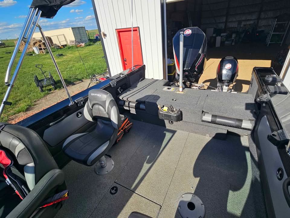 Interior of a 2020 Lund 1975 Tyee boat with engines.