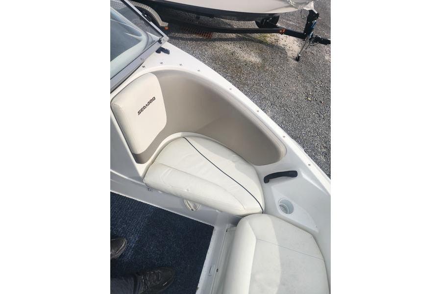 2012 Sea-Doo Sport Boats 180 Challenger interior seating with white upholstery and cup holder.
