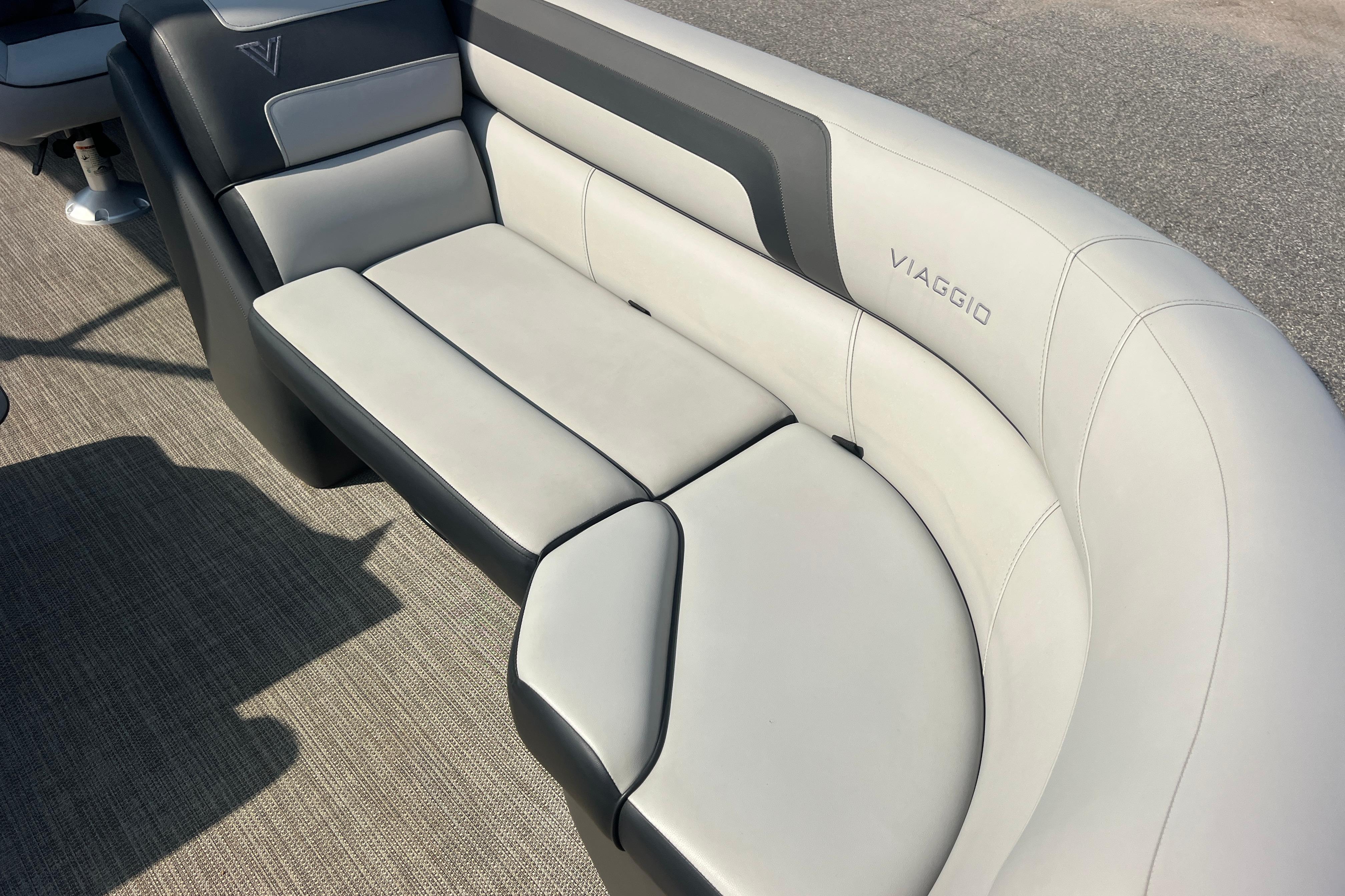 Luxurious seating on 2022 Viaggio Lago V-U 22 boat, featuring sleek design and comfort.
