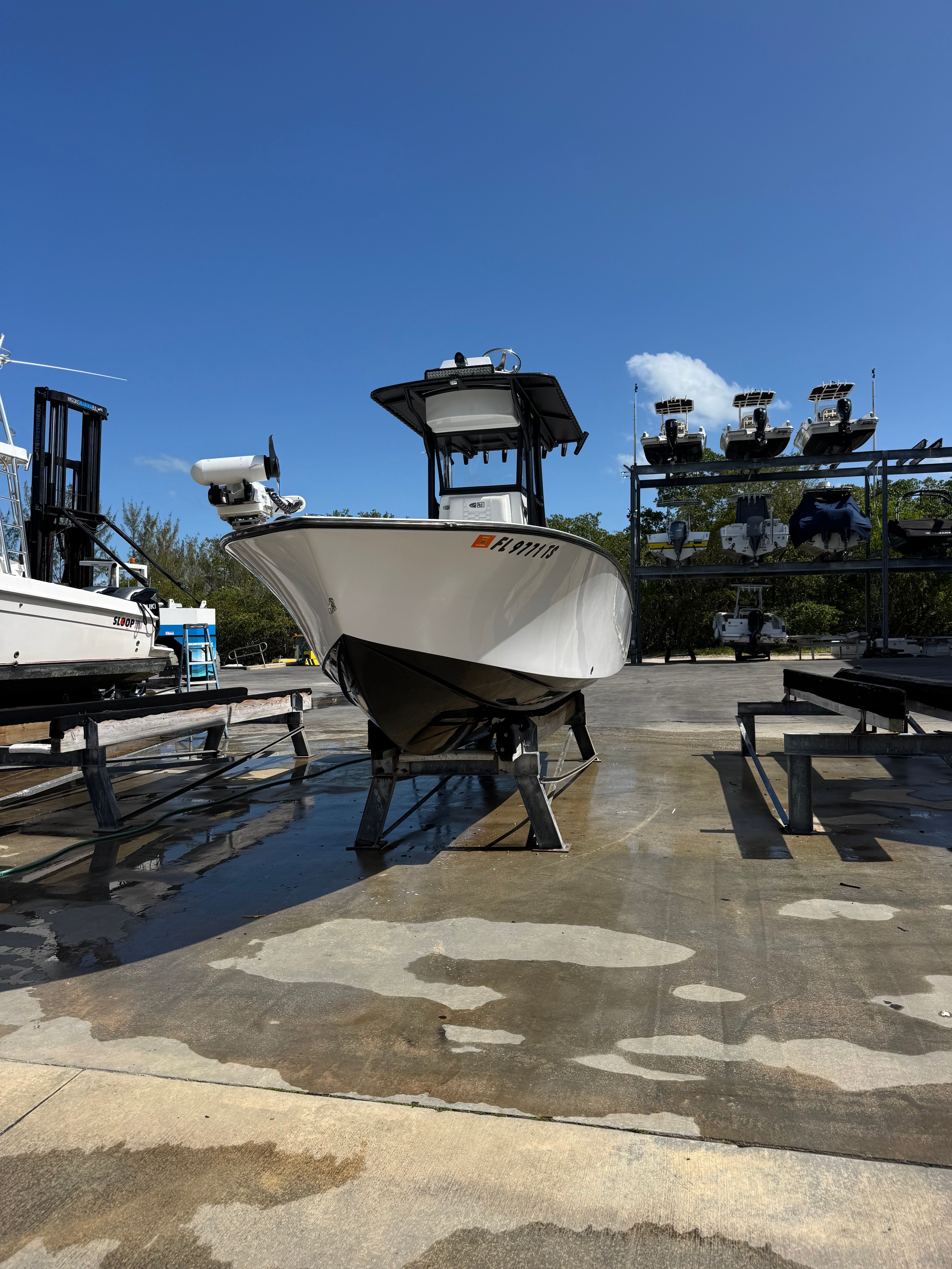 2024 Latitude Tournament Boats 25' CC on an outdoor boat stand.
