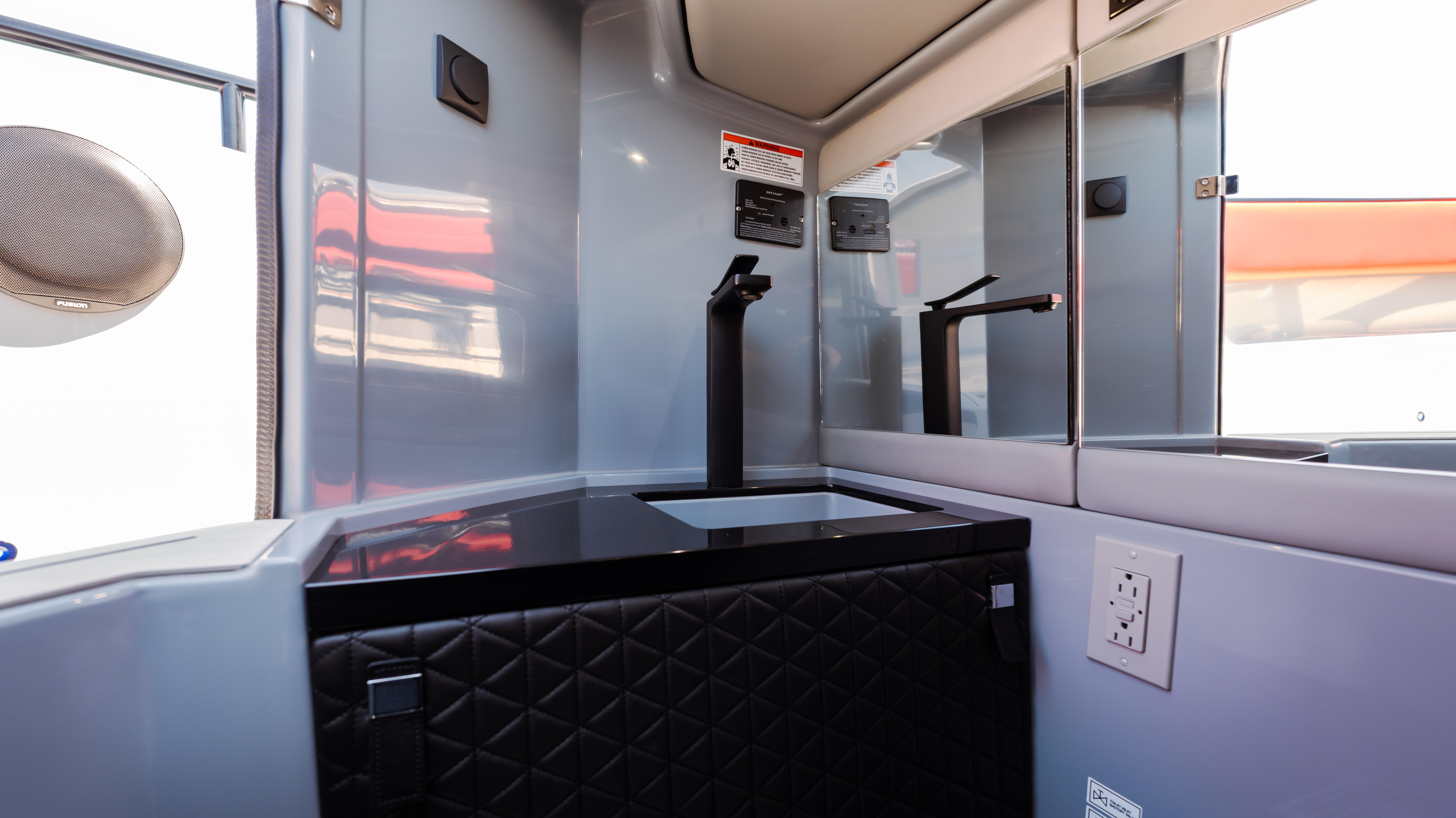 Interior of 2023 BRABUS Shadow 500 T-Top, featuring sleek design and modern amenities.