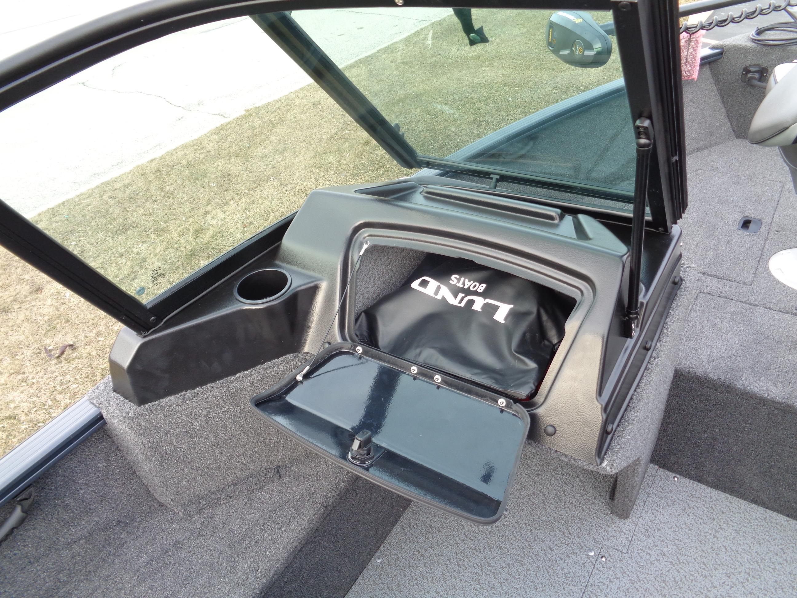 2024 Lund 1650 Rebel XL Sport boat interior with storage compartment open.