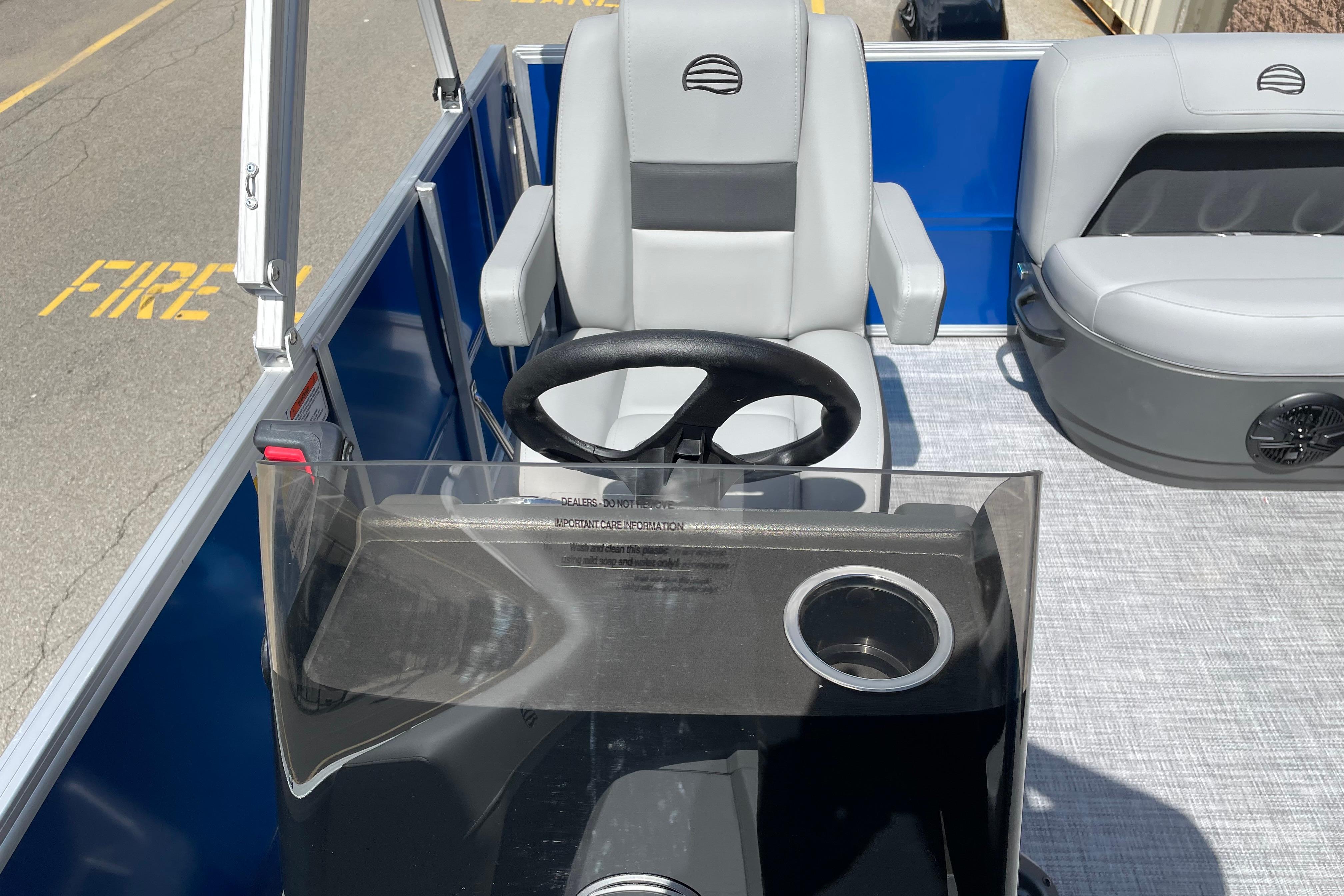 2026 Sun Tracker Party Barge 16 DLX interior with steering wheel and seating.
