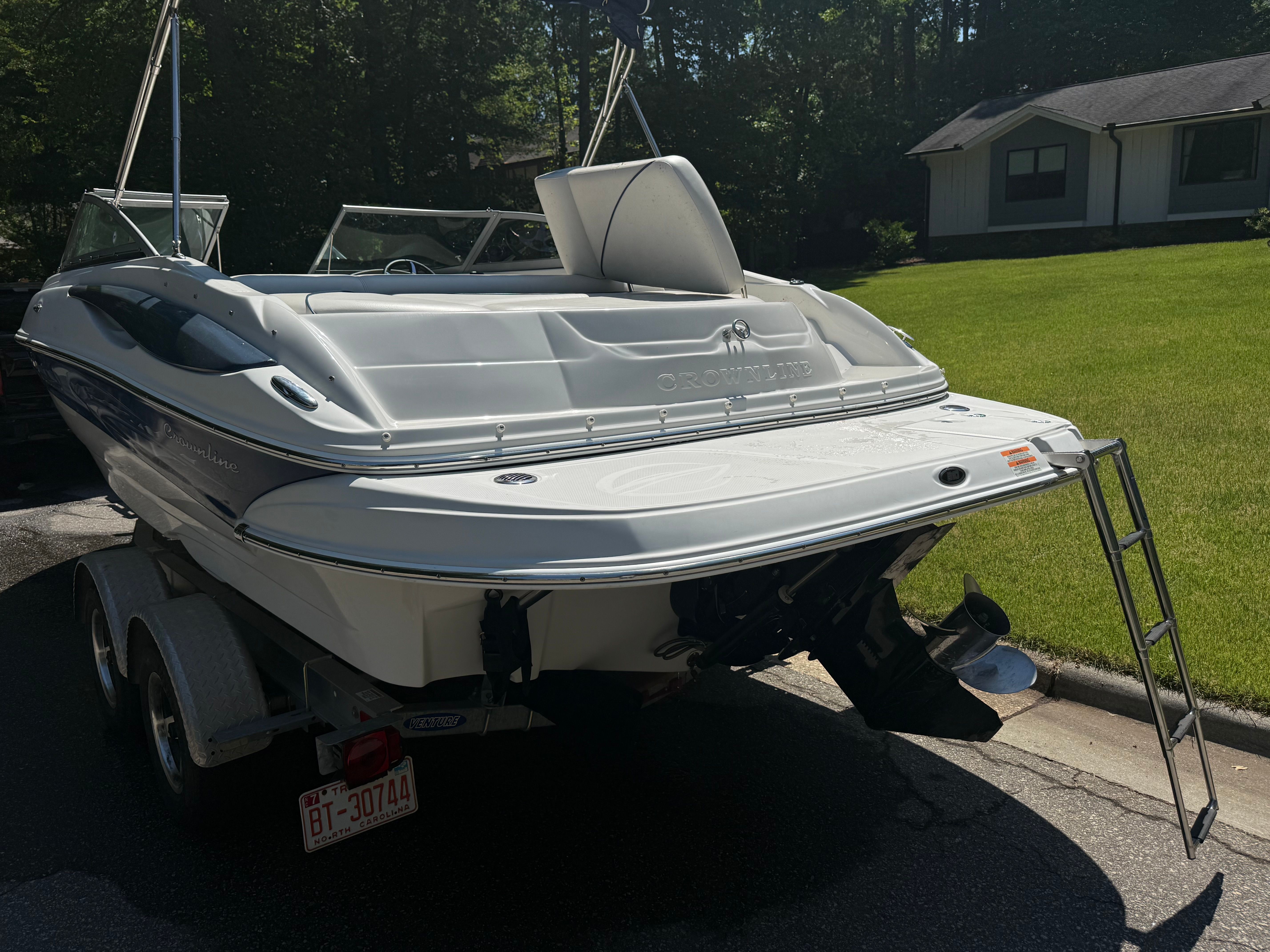 2008 Crownline 210 LX boat on trailer outdoors.