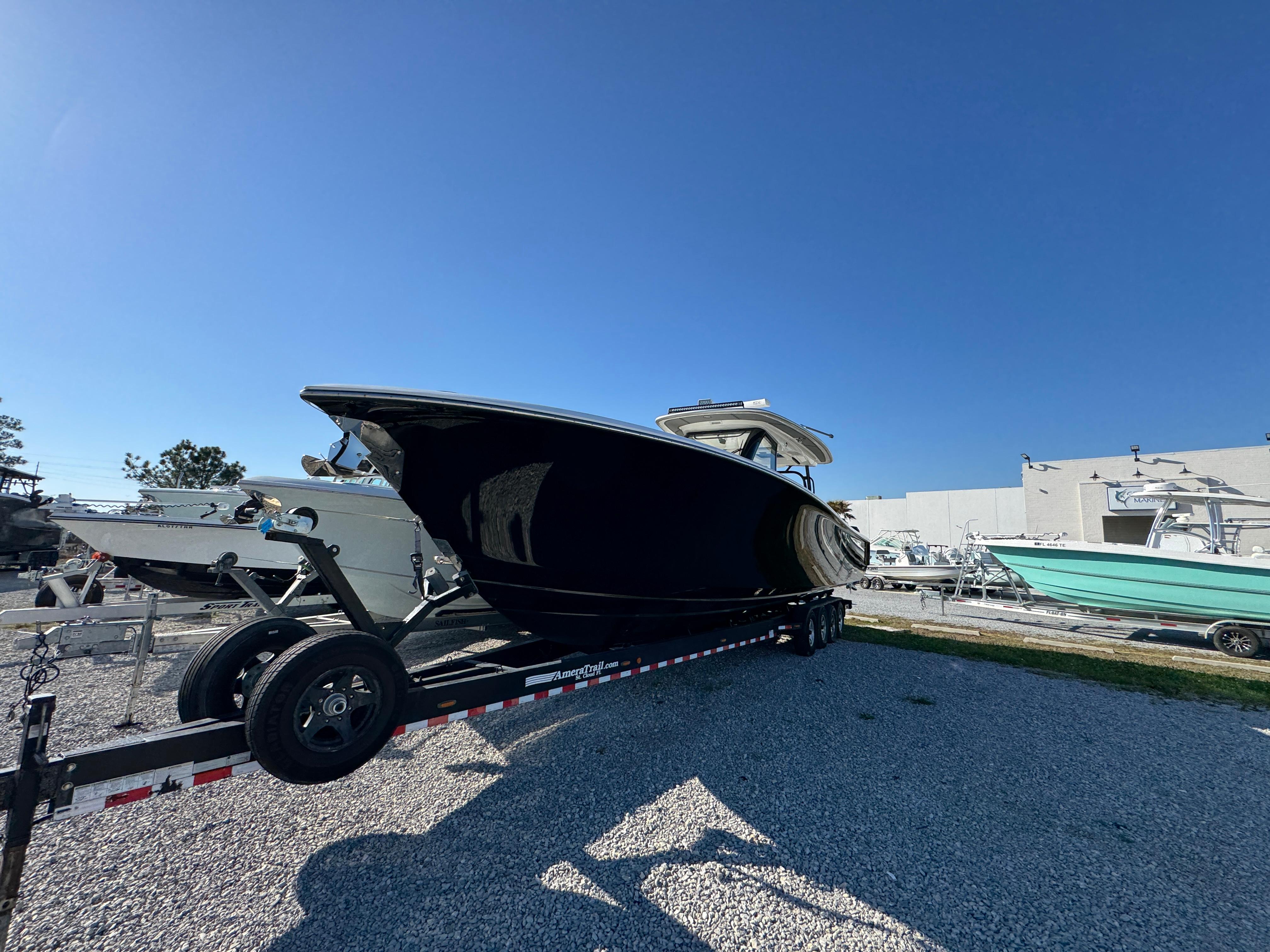 2019 Blackwater 43SF boat on trailer, parked outdoors under clear blue sky.