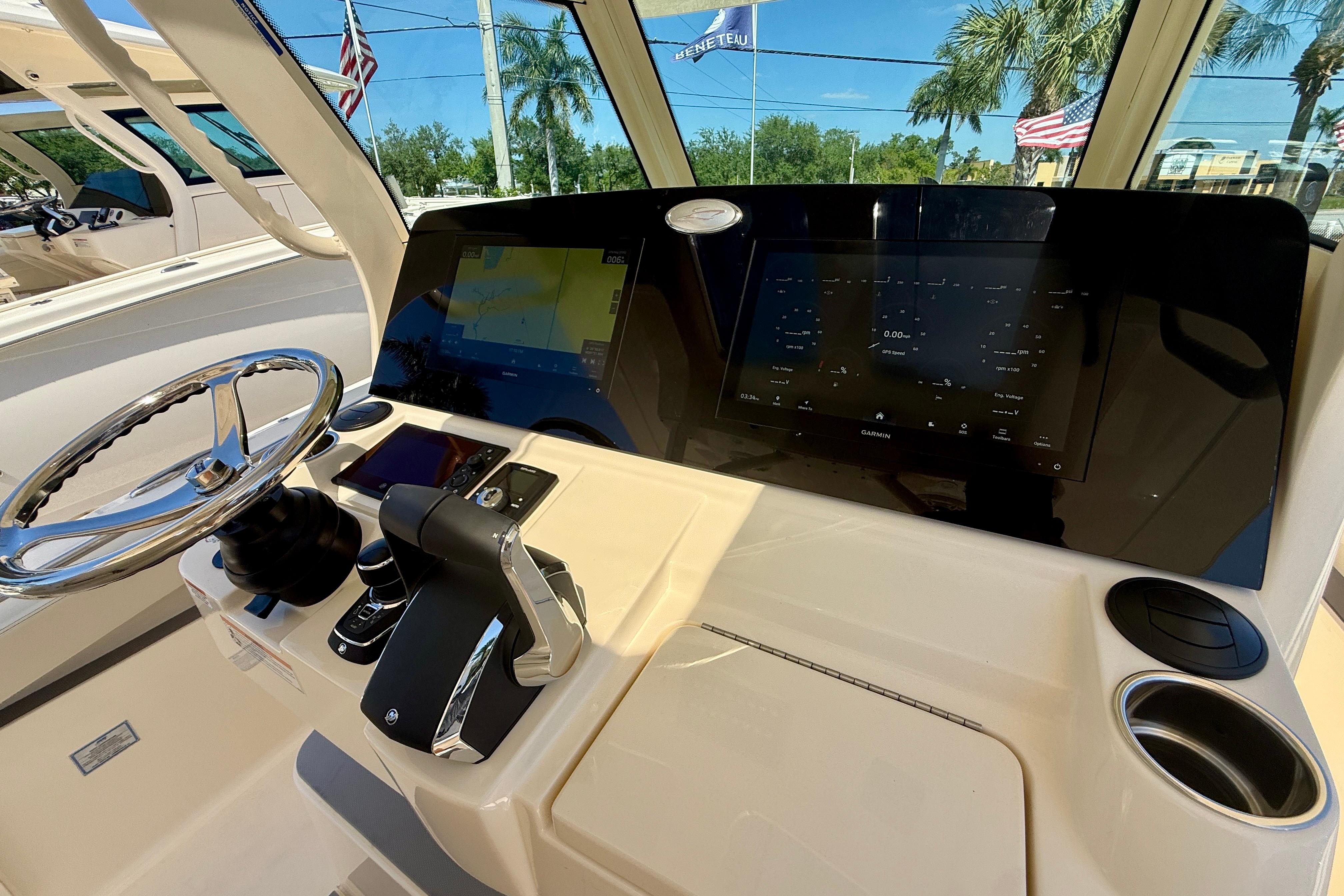 Helm of 2026 Scout 330 LXF boat with advanced navigation display and controls.