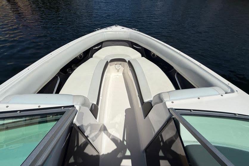 2014 Regal 2500 Bowrider boat interior with open bow seating on water.