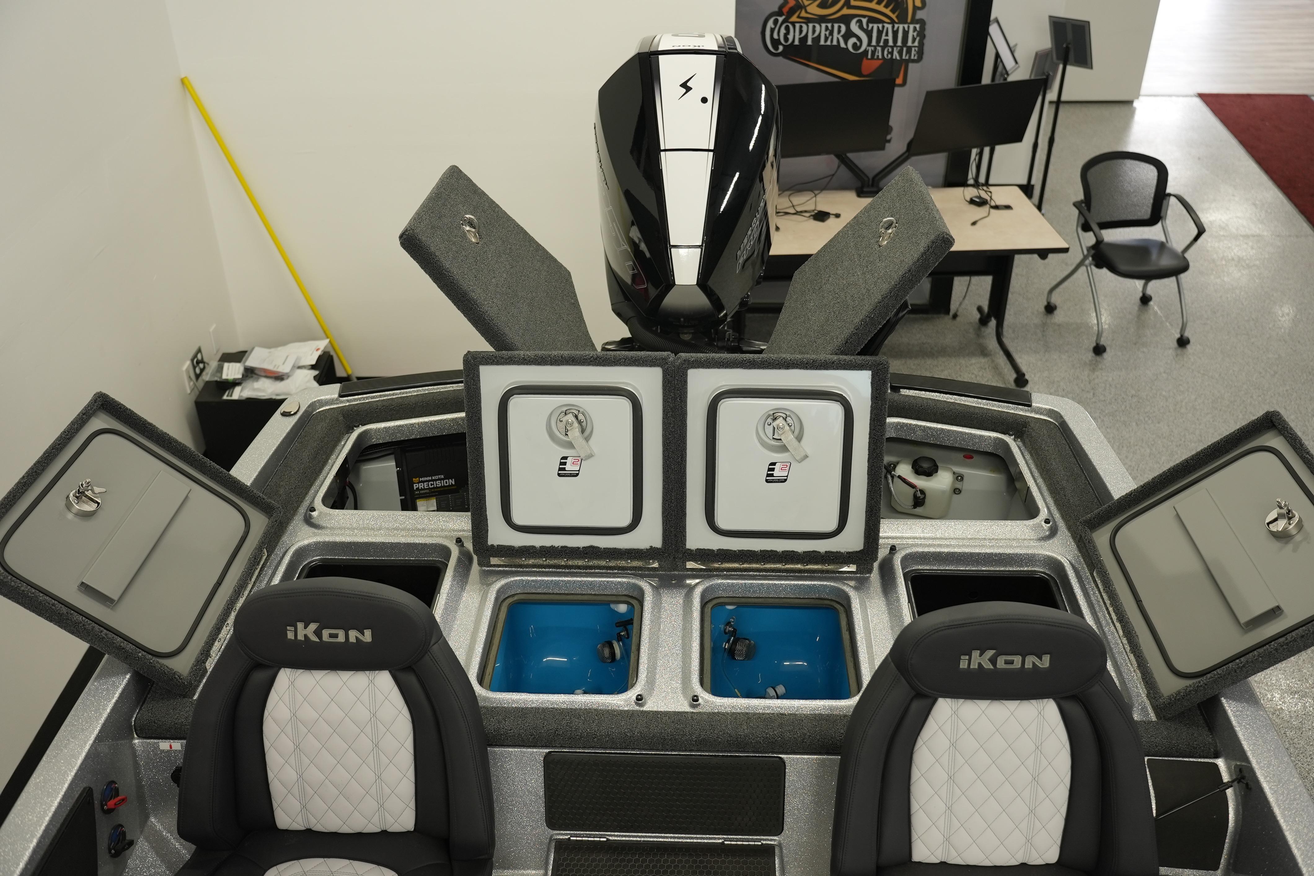 2026 iKon LXE20 boat interior with open storage compartments and seating.