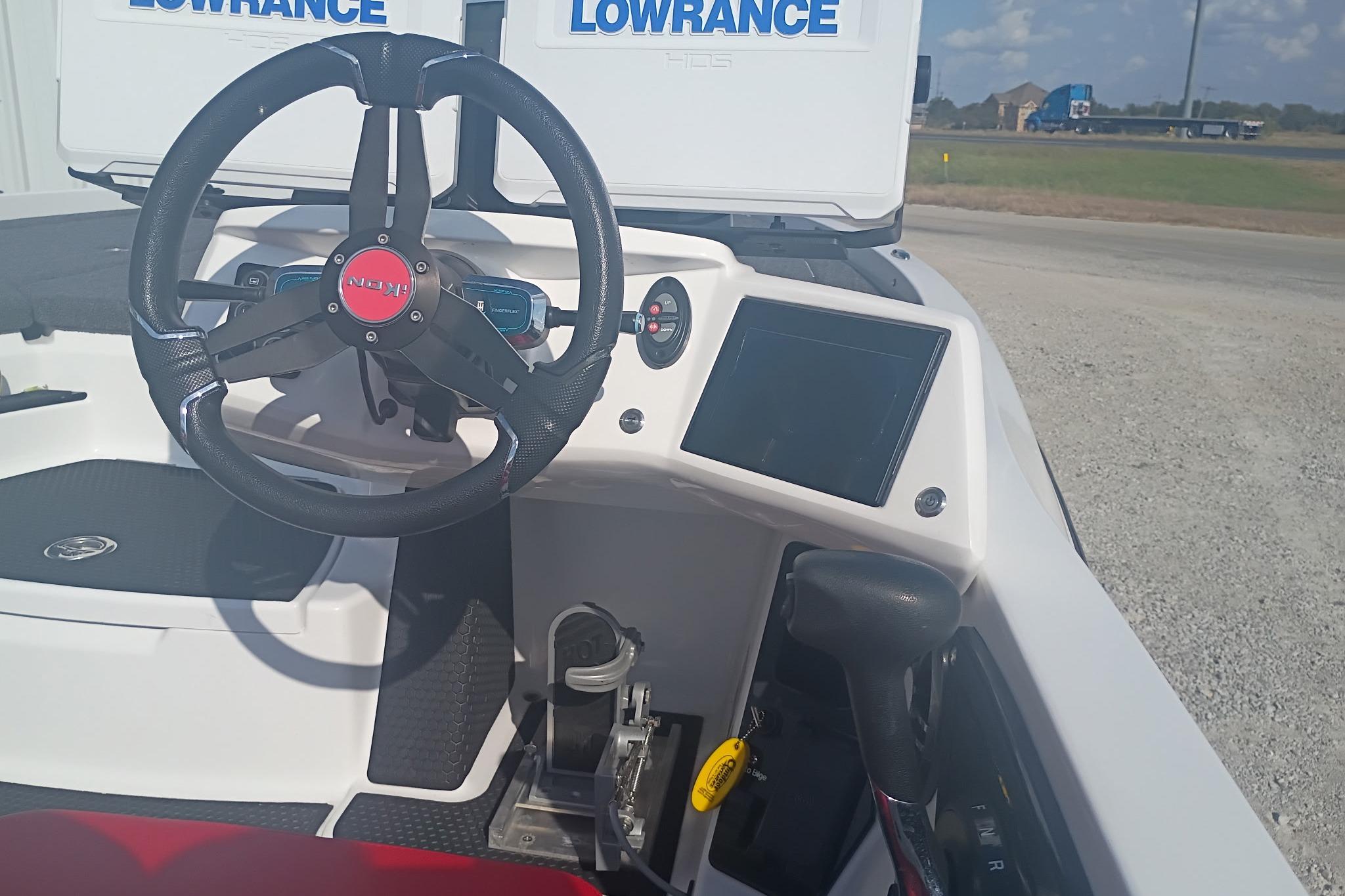 2024 iKon LX21 boat dashboard with steering wheel and navigation display.