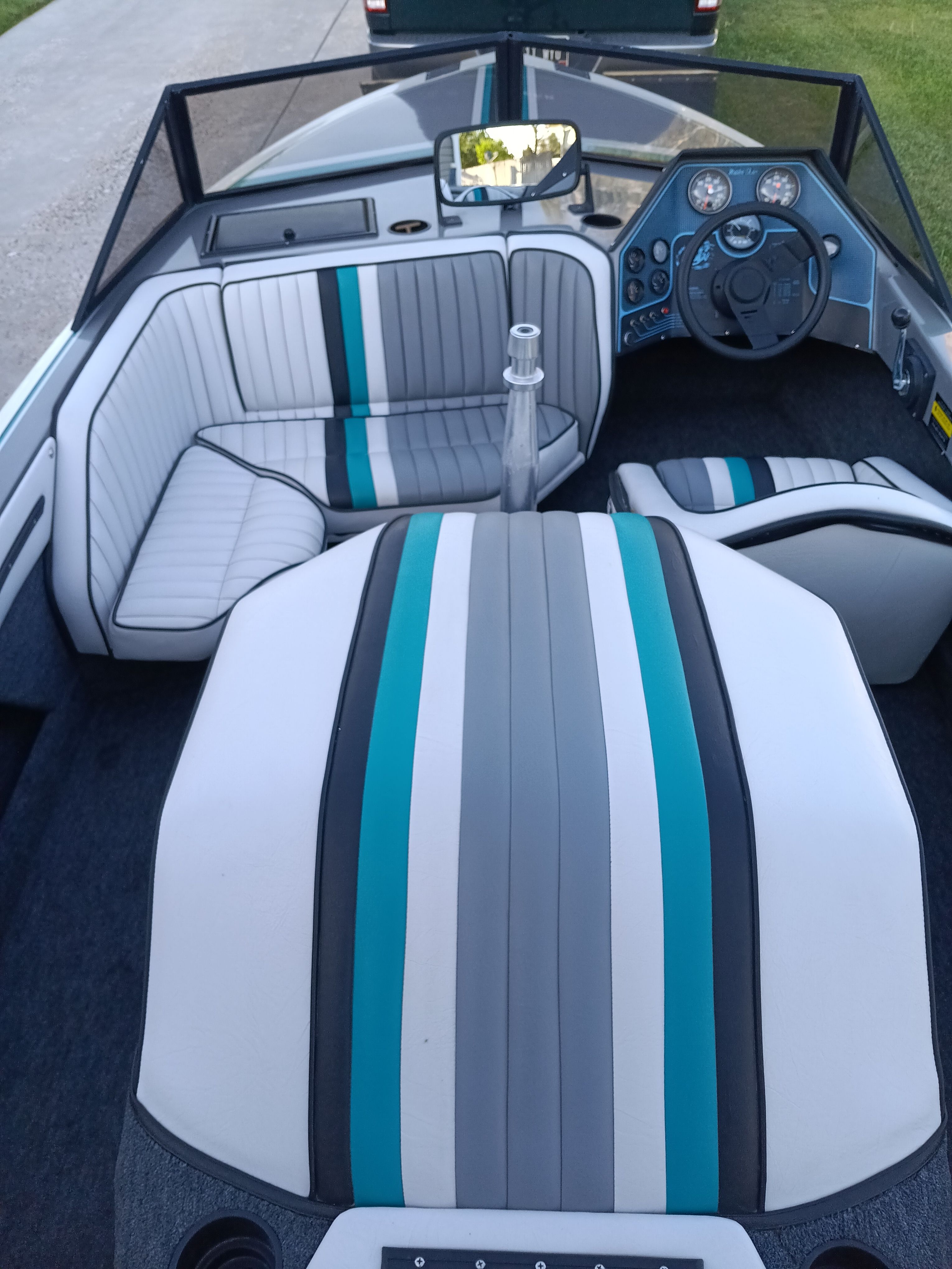 Interior of a 1991 Malibu Skier boat with striped seating.