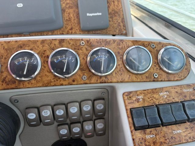 Dashboard of a 2007 Formula 34 Performance Cruiser with wood trim and multiple gauges.
