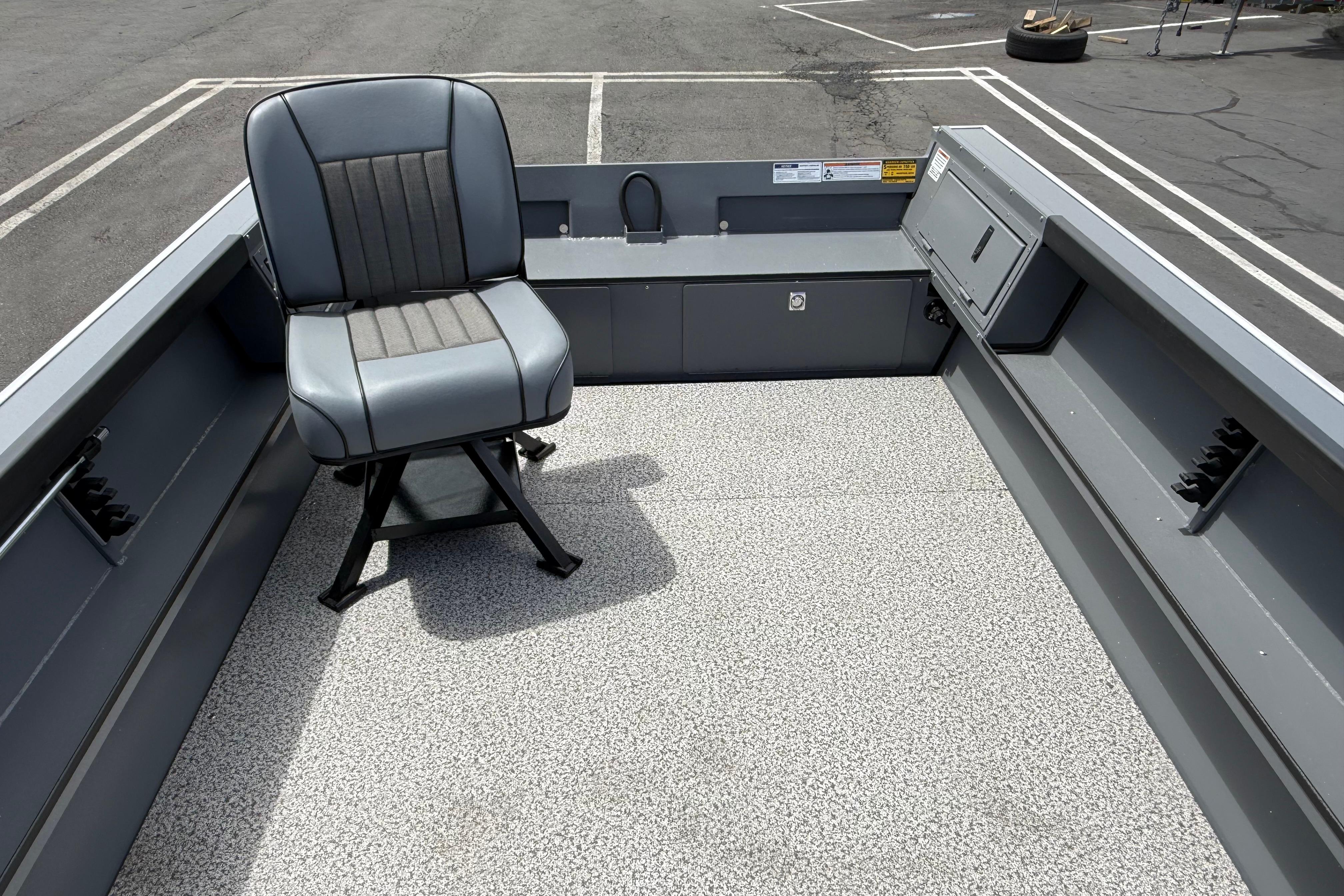 2026 Alumaweld Free Drifter 20 boat interior with gray seating and textured flooring.