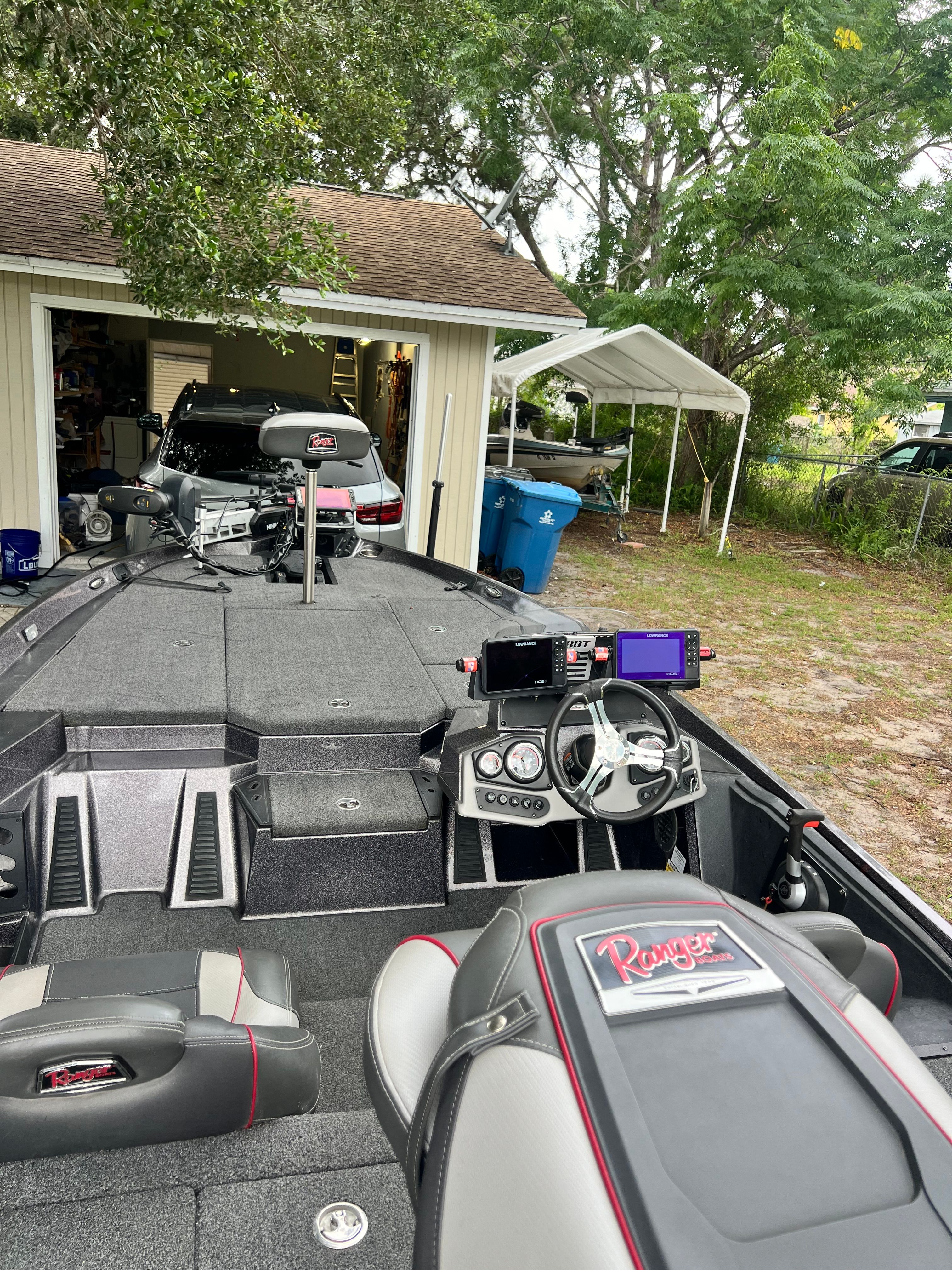 2022 Ranger Z185 boat parked outdoors in front of a garage.