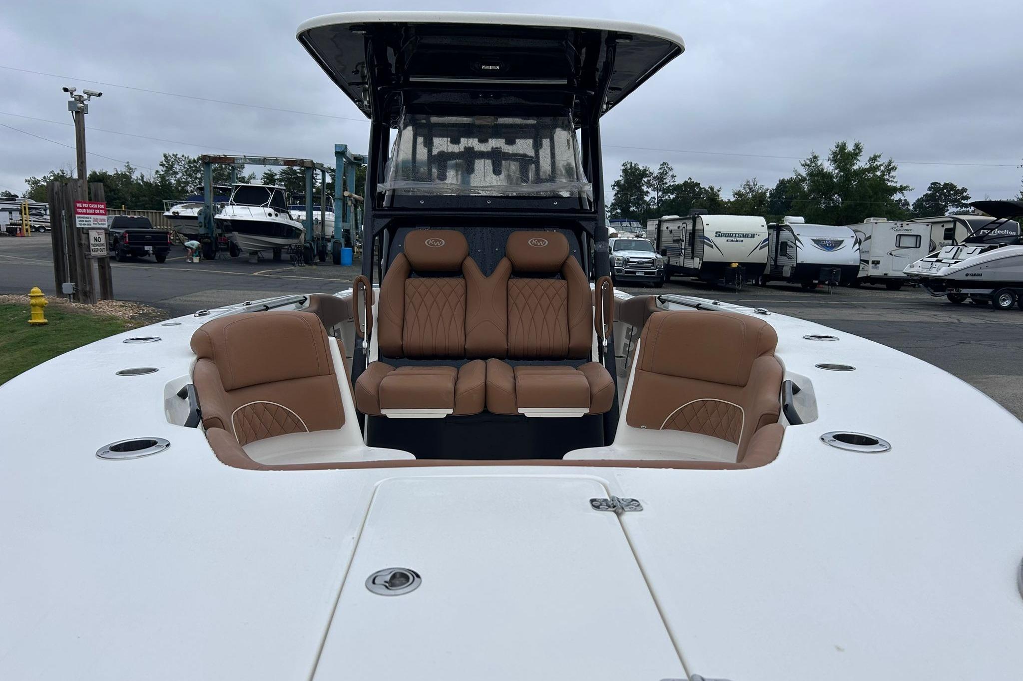 2026 Key West 291 FS boat with tan seating, docked in a marina.